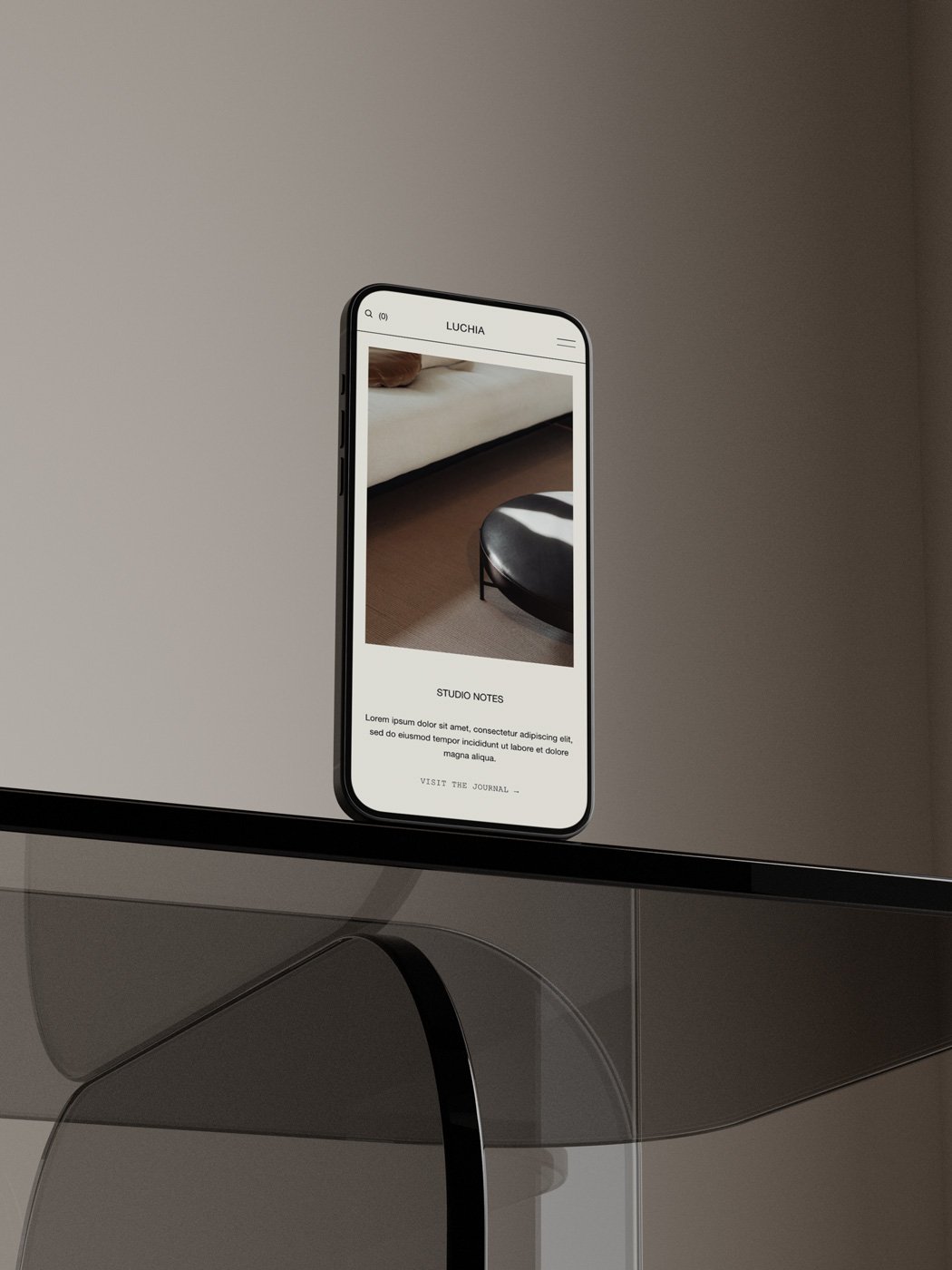 Hand with a silver ring holding a blank notebook beside an espresso, a clean editorial workspace for creative brand resources.