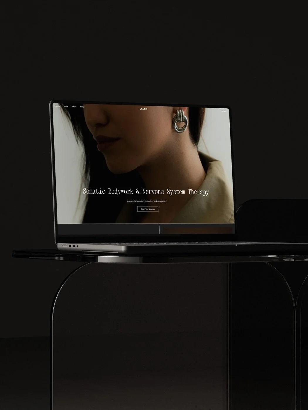 The Olena Squarespace therapy template displayed on a laptop screen.