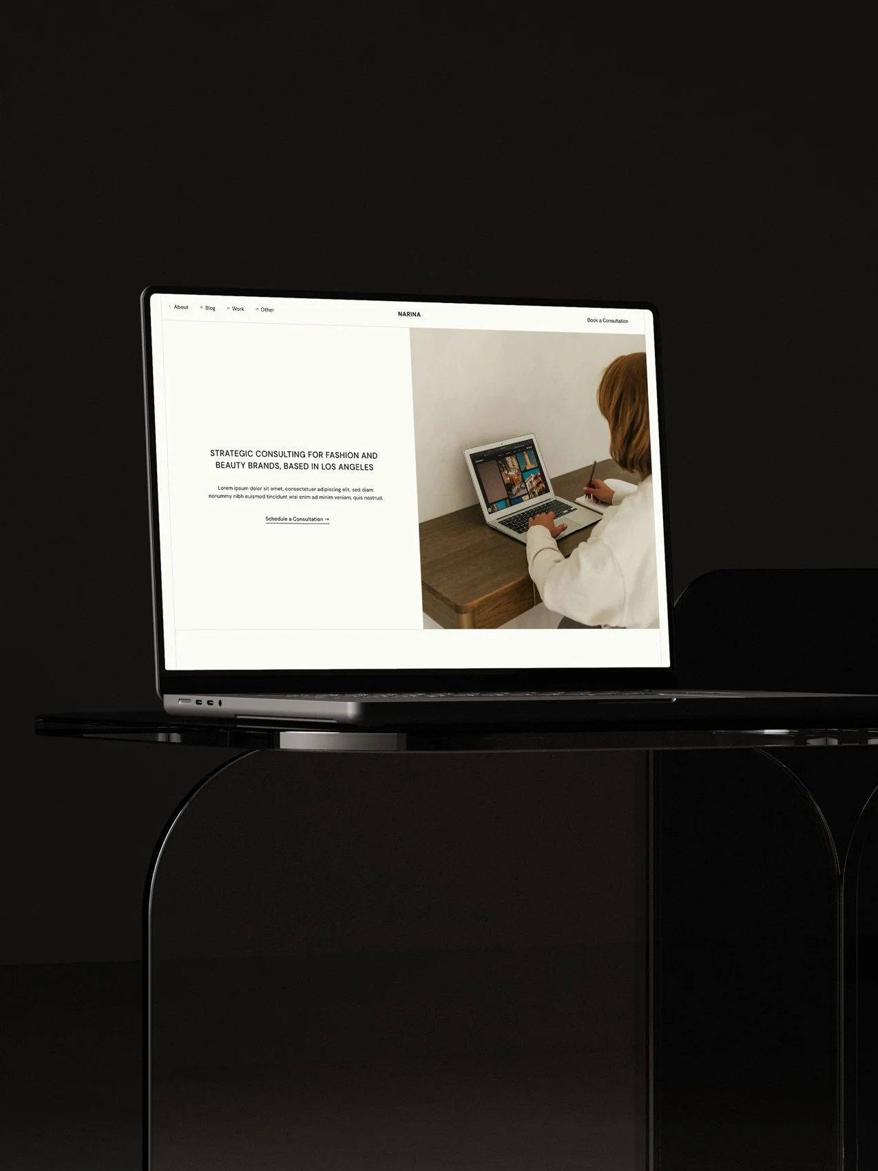 The Narina Squarespace Template displayed on a laptop screen.