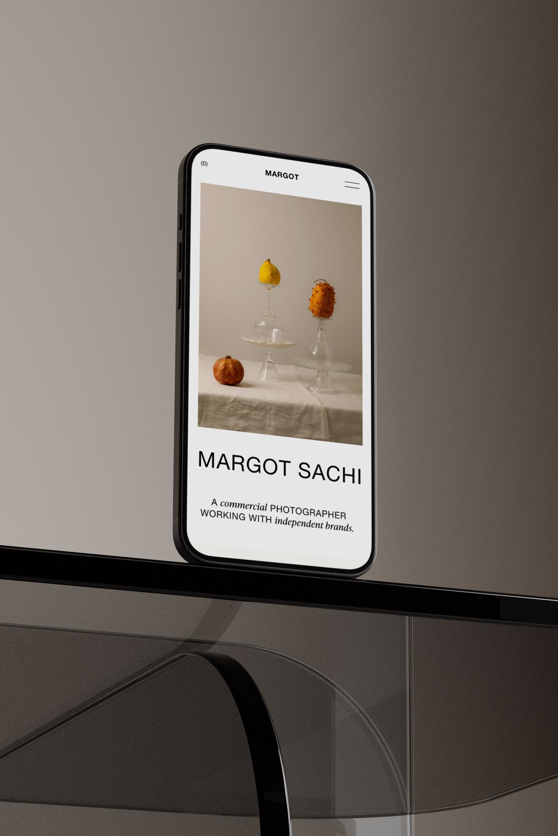 The Margot Squarespace photography template displayed on a mobile phone screen.
