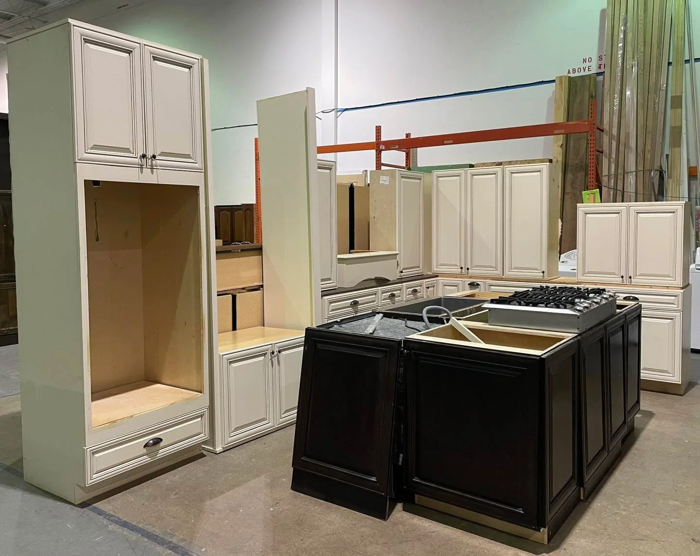 Kitchen cabinet set $2200 - around 27&rsquo; of base cabinets, including dark colored island, includes Dacor cooktop, Samsung dishwasher, apron sink at no additional charge. Not sold separately