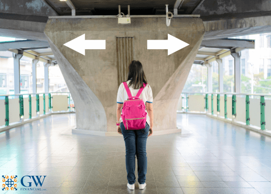 Girl with pink backpack at crossroads in hallway