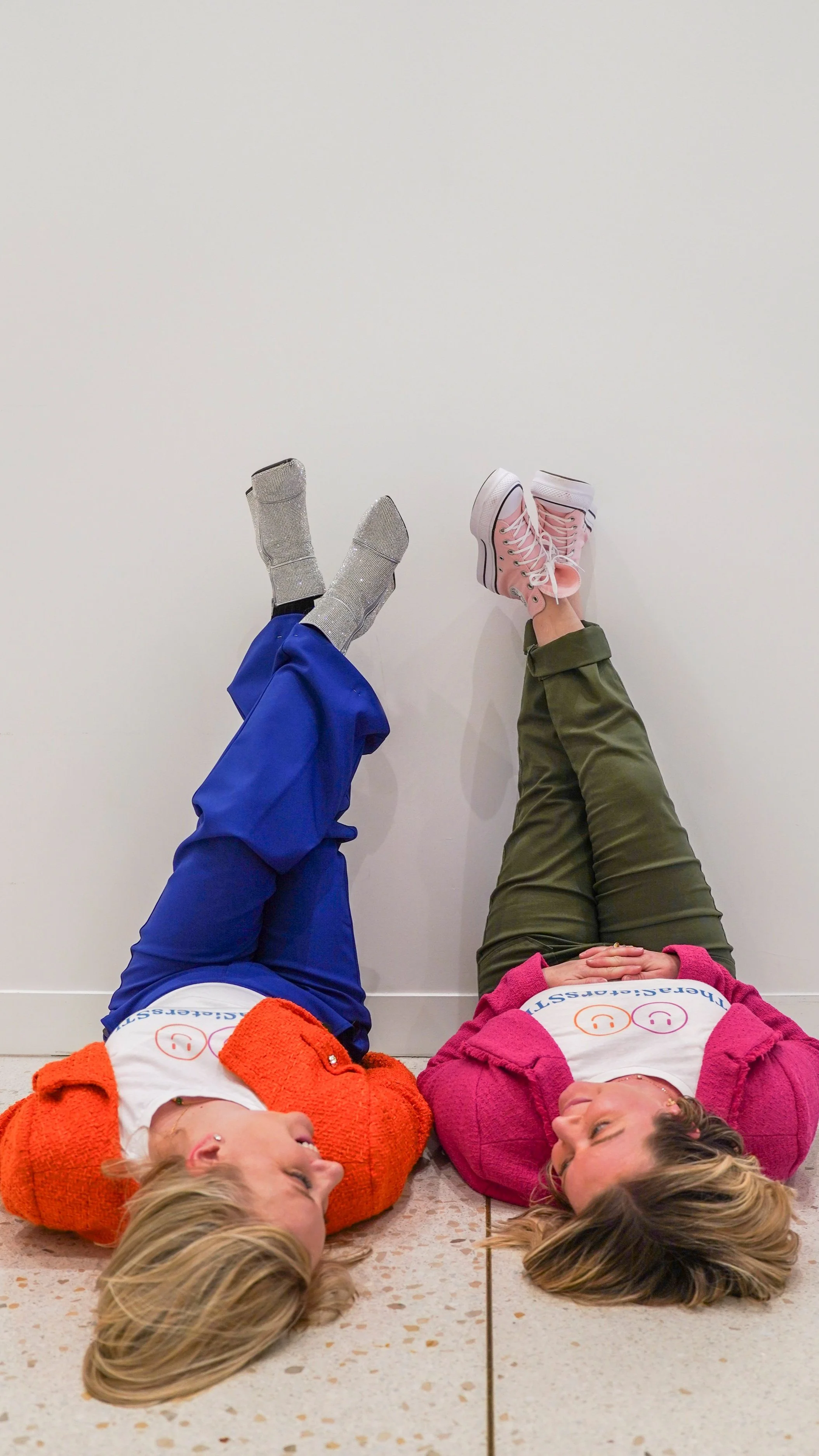 Playful image of TheraSistersSTL's Amy and Katheryn, illustrating their fresh take on therapist support and community building.