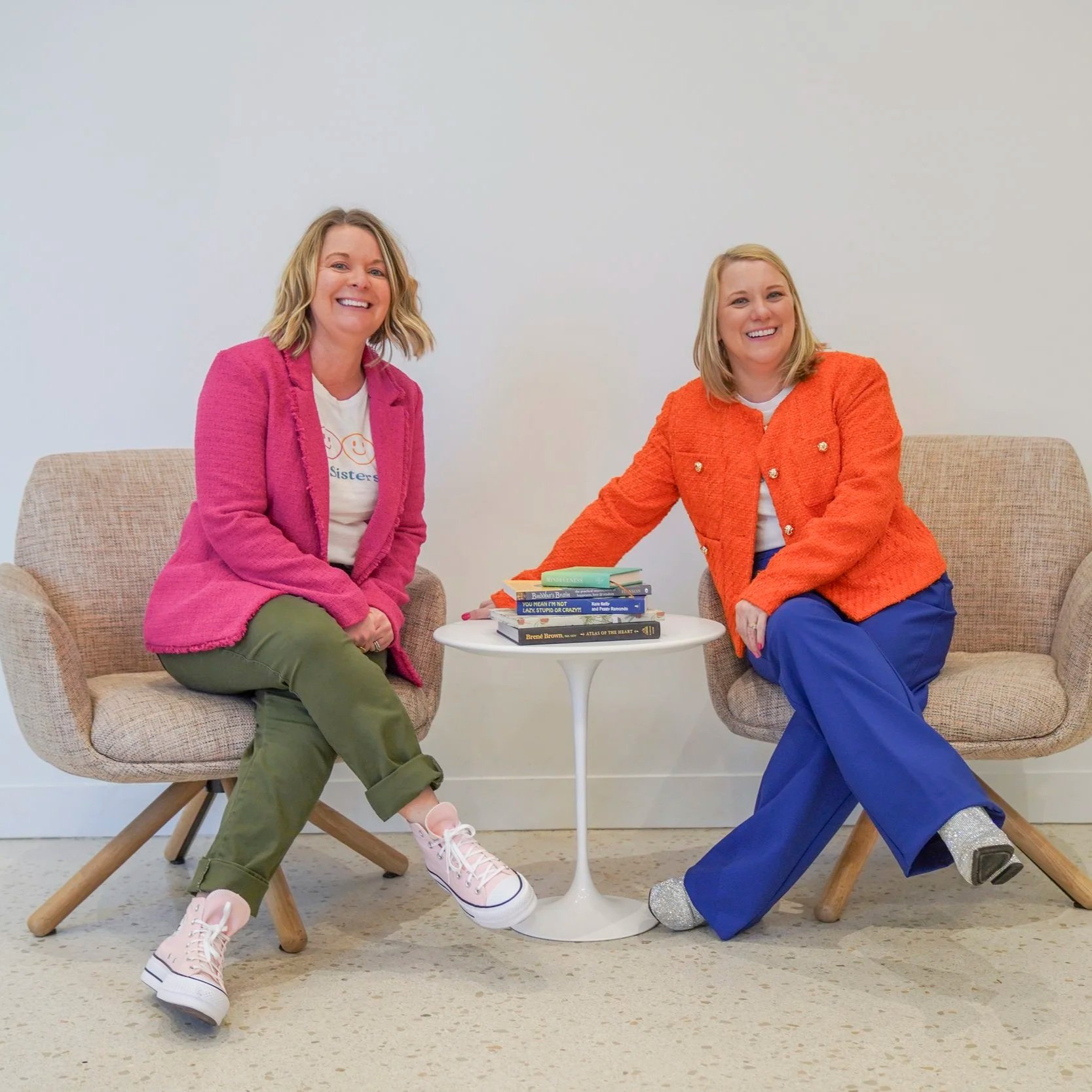TheraSistersStL sitting with books