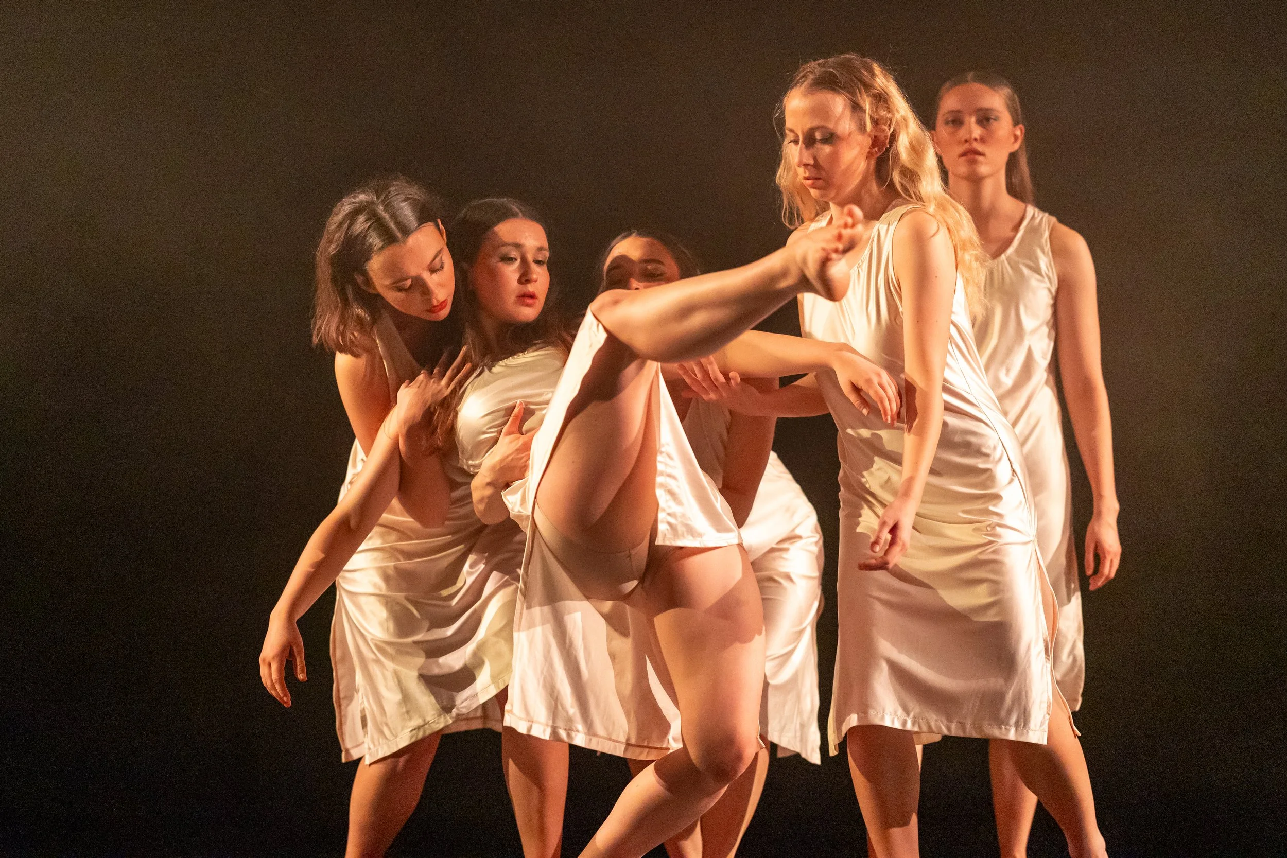 5 dancers in white dresses