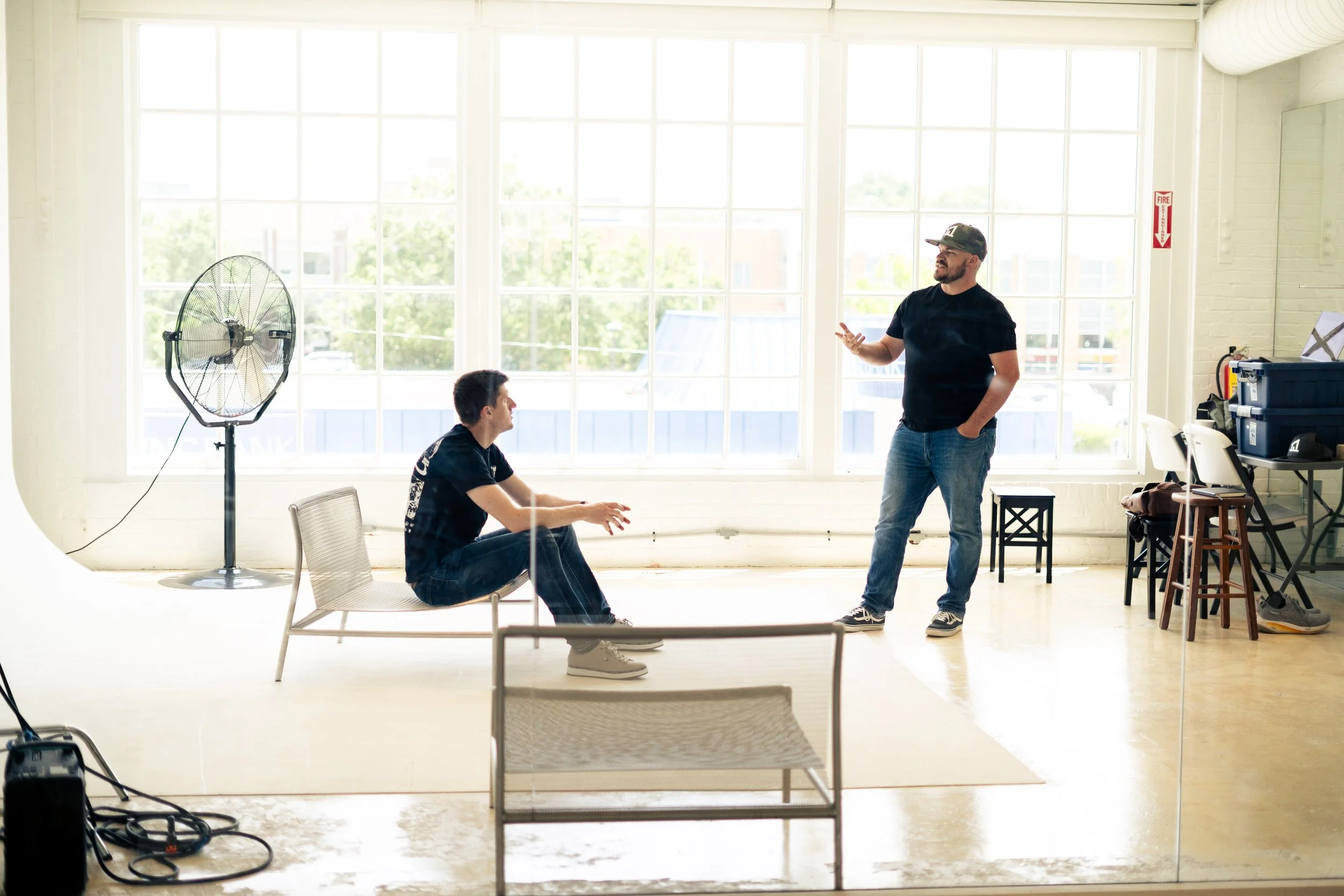 Cabin One Design Founders, David Vincent and Nic Beardsley in an in-depth conversation with a backdrop of windows and natural light