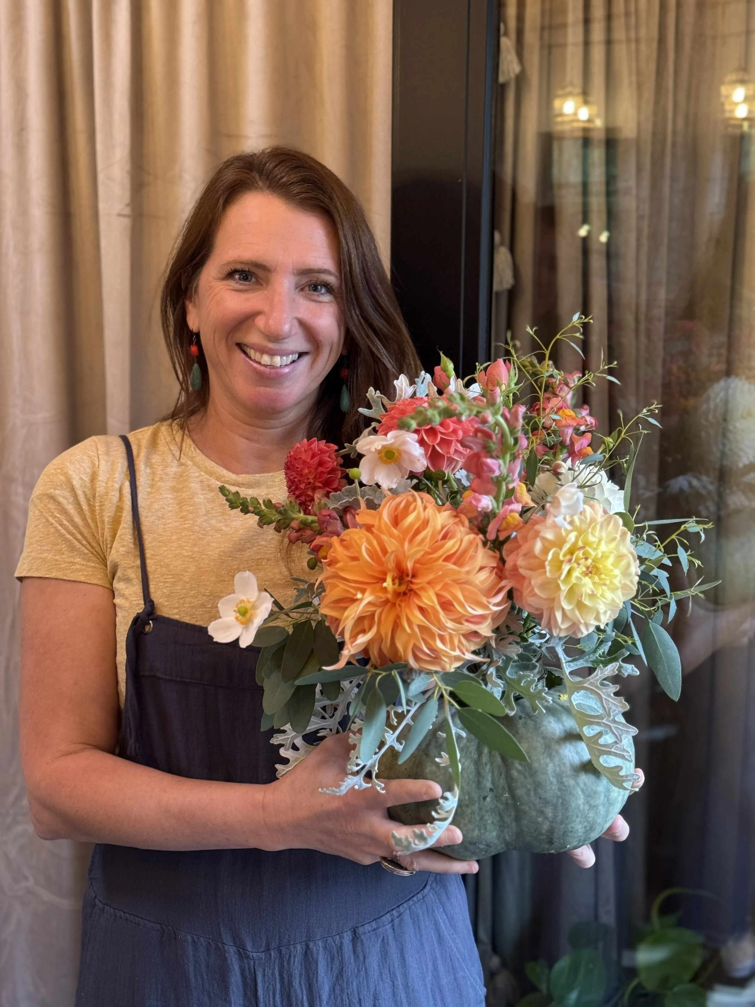 cute woman with pumpkin at KBB bouquet bar 2025.jpg