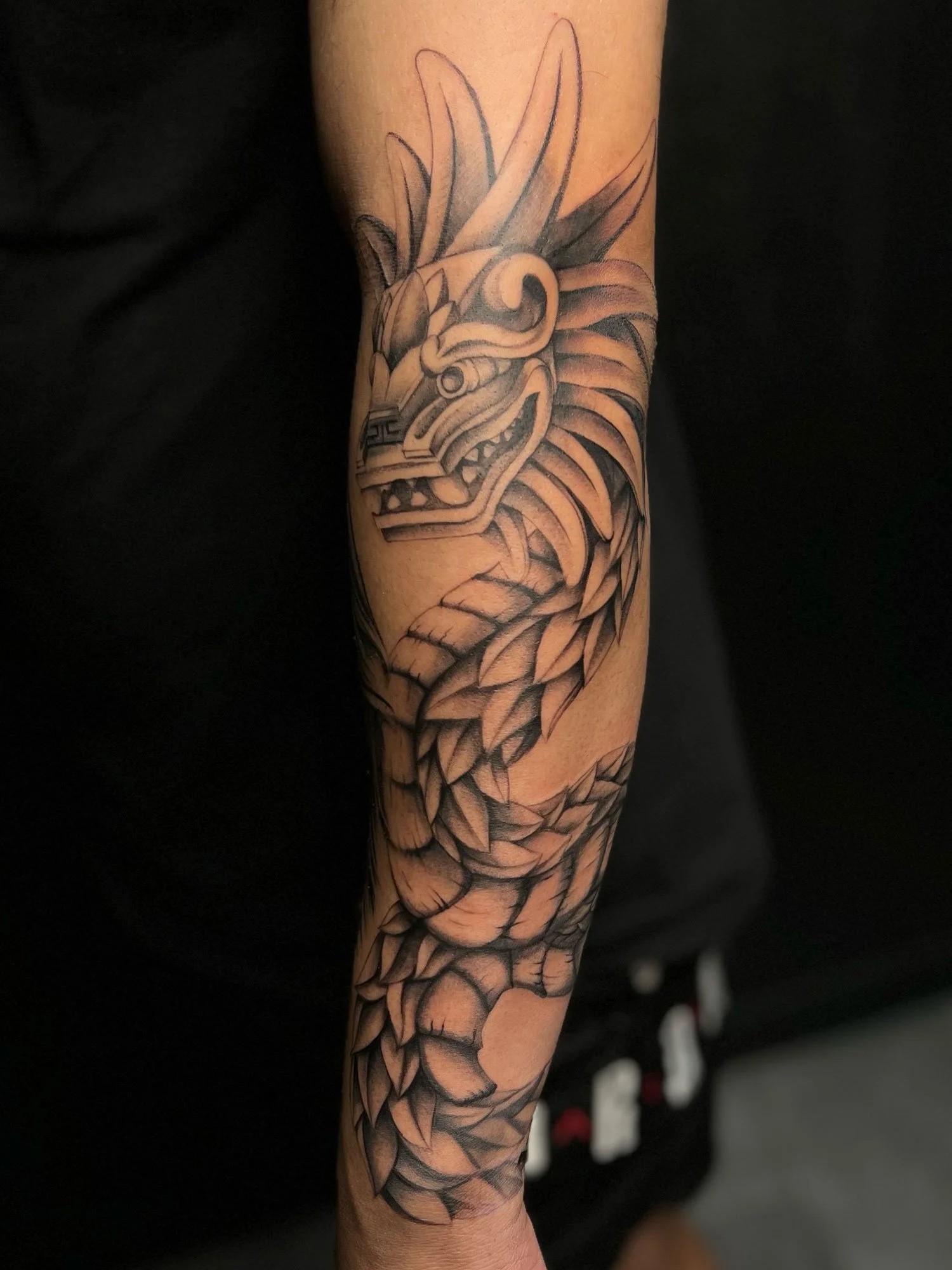 elizagreed-san-diego-black-grey-realism-aztec-serpant-tattoo.jpg