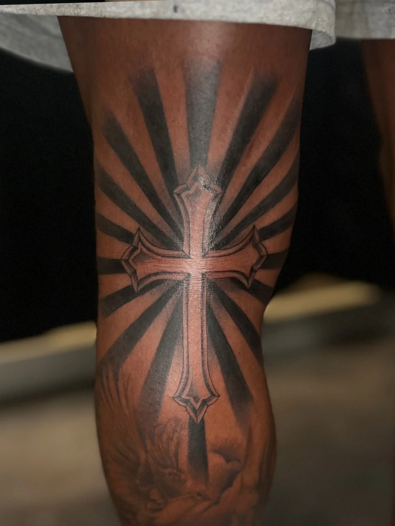 elizagreed-san-diego-black-grey-realism-knee-cross-tattoo.jpg