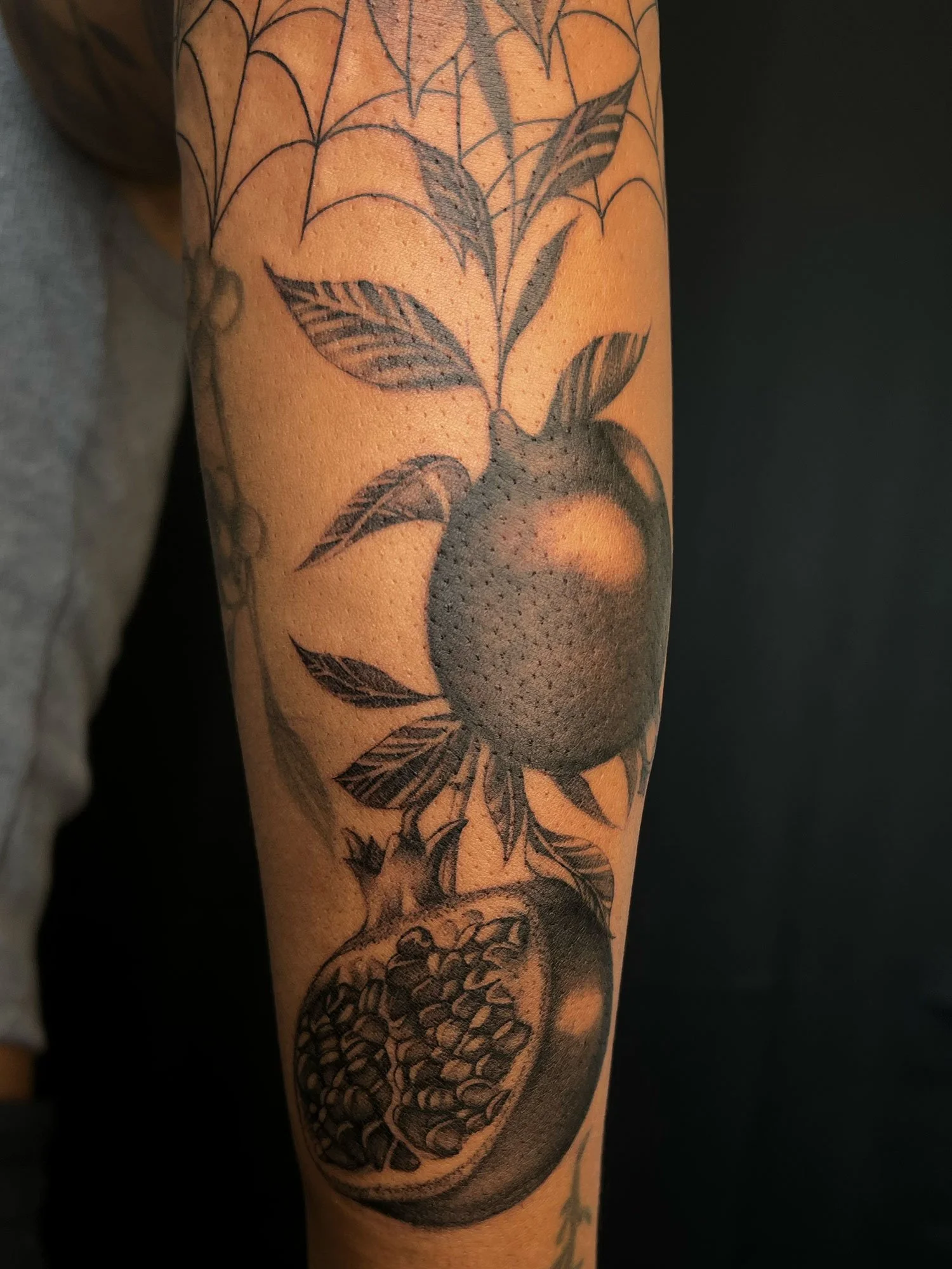 elizagreed-san-diego-black-grey-realism-pomegranate-tattoo.jpg
