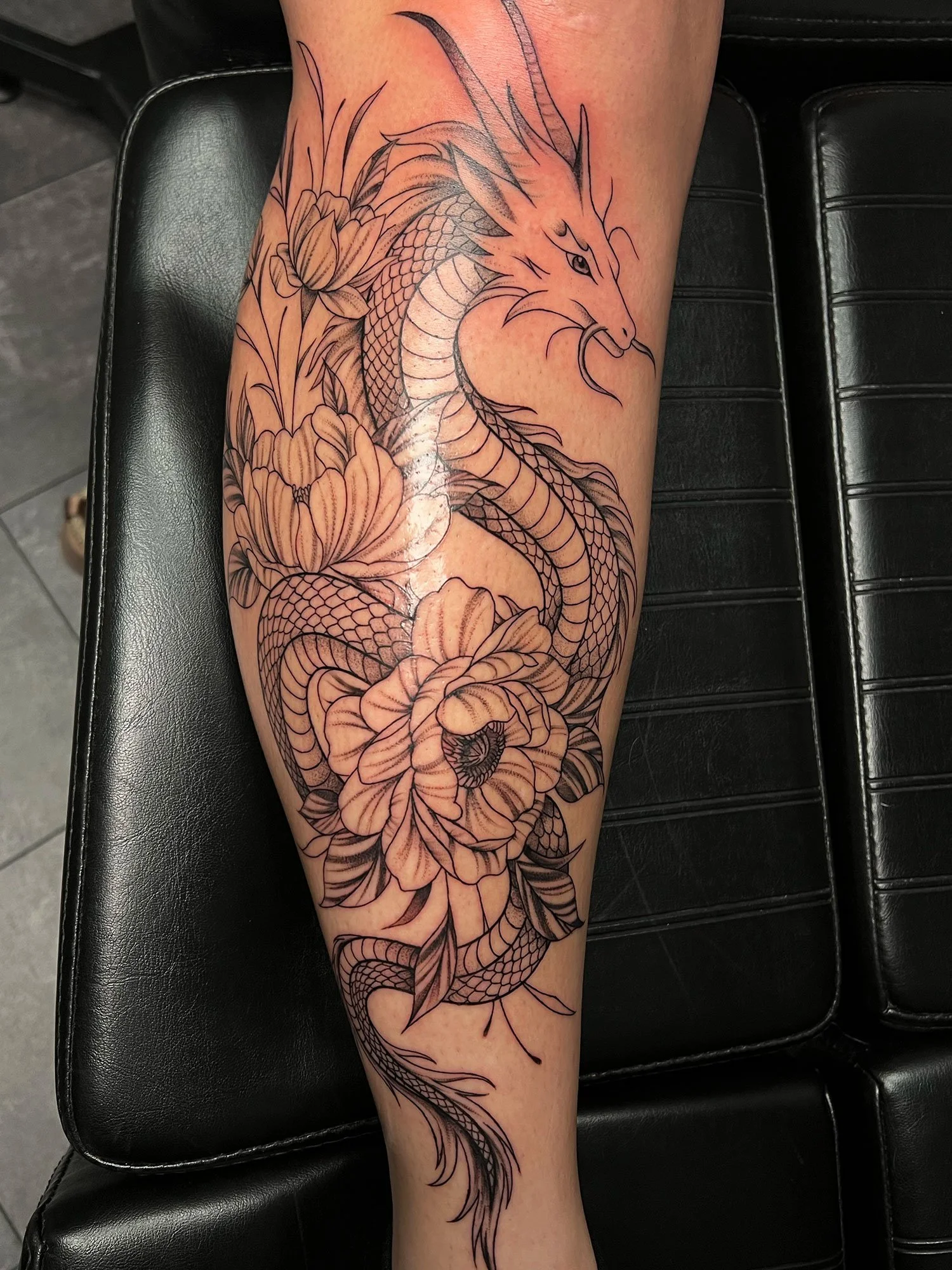 elizagreed-san-diego-black-grey-fineline-dragon-floral-tattoo.jpg