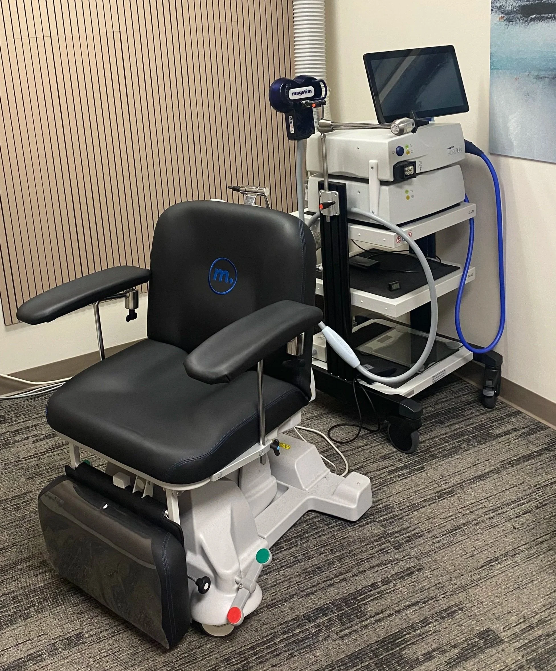 TMS treatment chair and magnetic-stimulation equipment at Southeast Virginia Psychiatry.