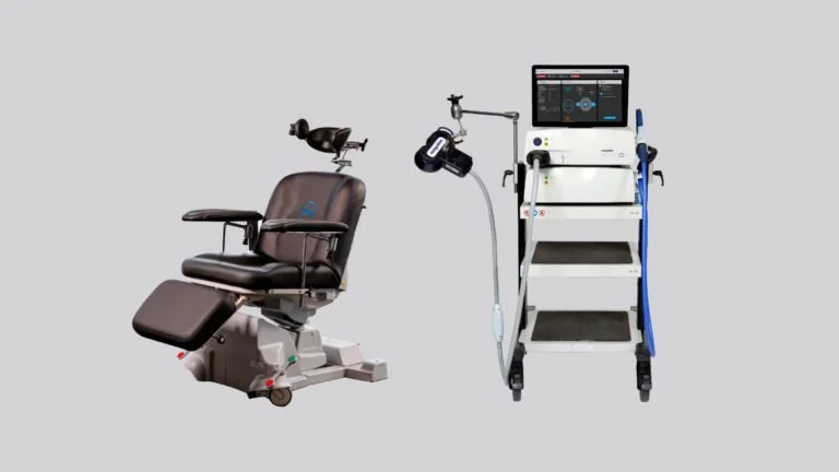 Medical rehabilitation machine with a padded chair and a monitor