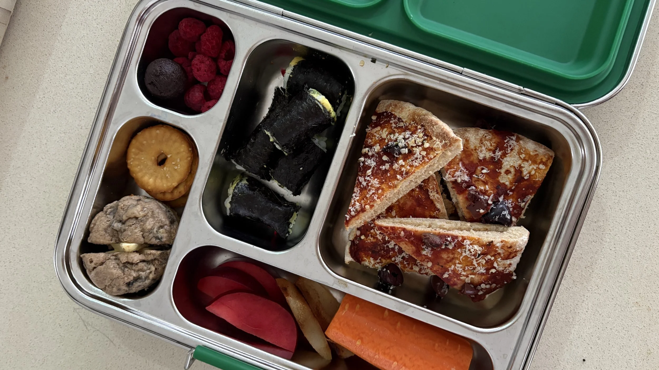 Toddlers healthy low-tox lunchbox containing fruit and veg, carbohydrates, protein, fats and fun