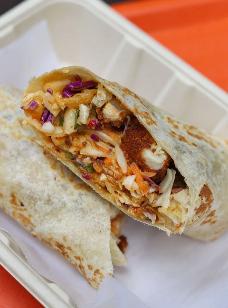 Weekdays call for our Asian Crispy Chicken Salad Wrap! Dirty chicken tenders, cabbage, cilantro, crispy noodles, almonds &amp; gochujang orange miso vinaigrette!