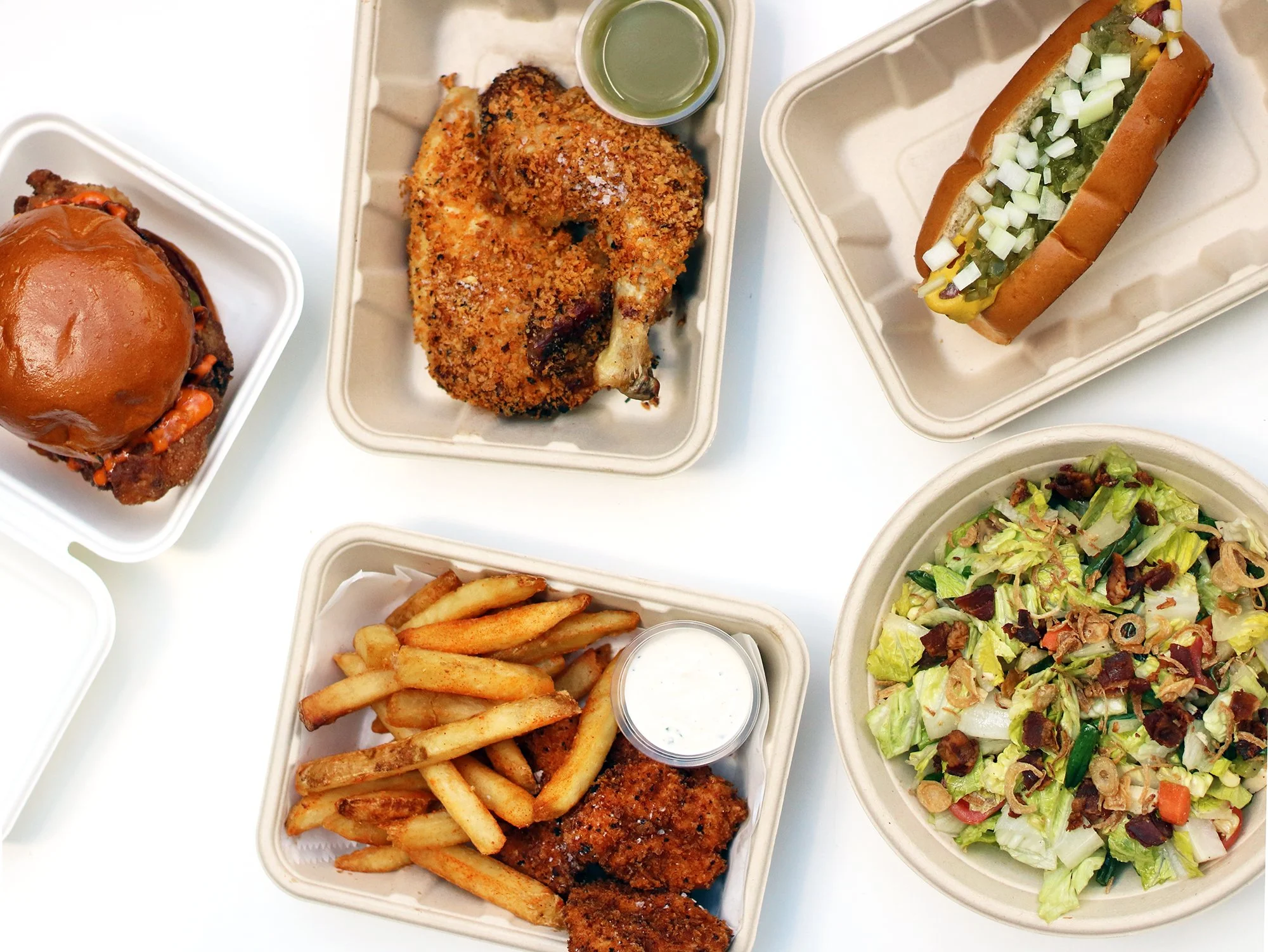 Some of the menu including the Fried Chicken Sandwich, Santa Monica Chopped Salad, Dirty Chicken, Classic Hot Dog, and Dirty Chicken Tenders with Fries and Ranch