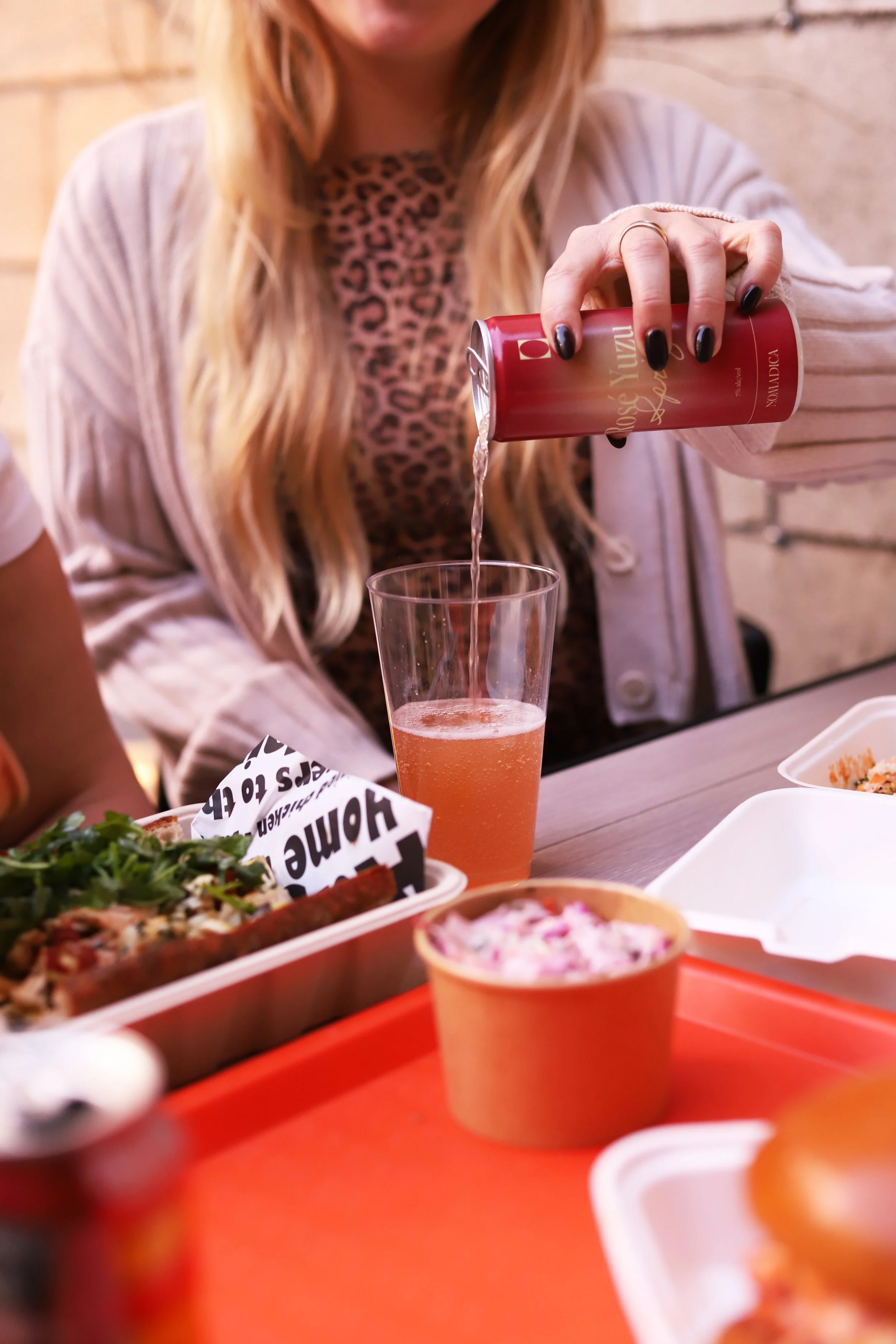 Pouring wine into a cup at the best casual restaurant in Santa Monica