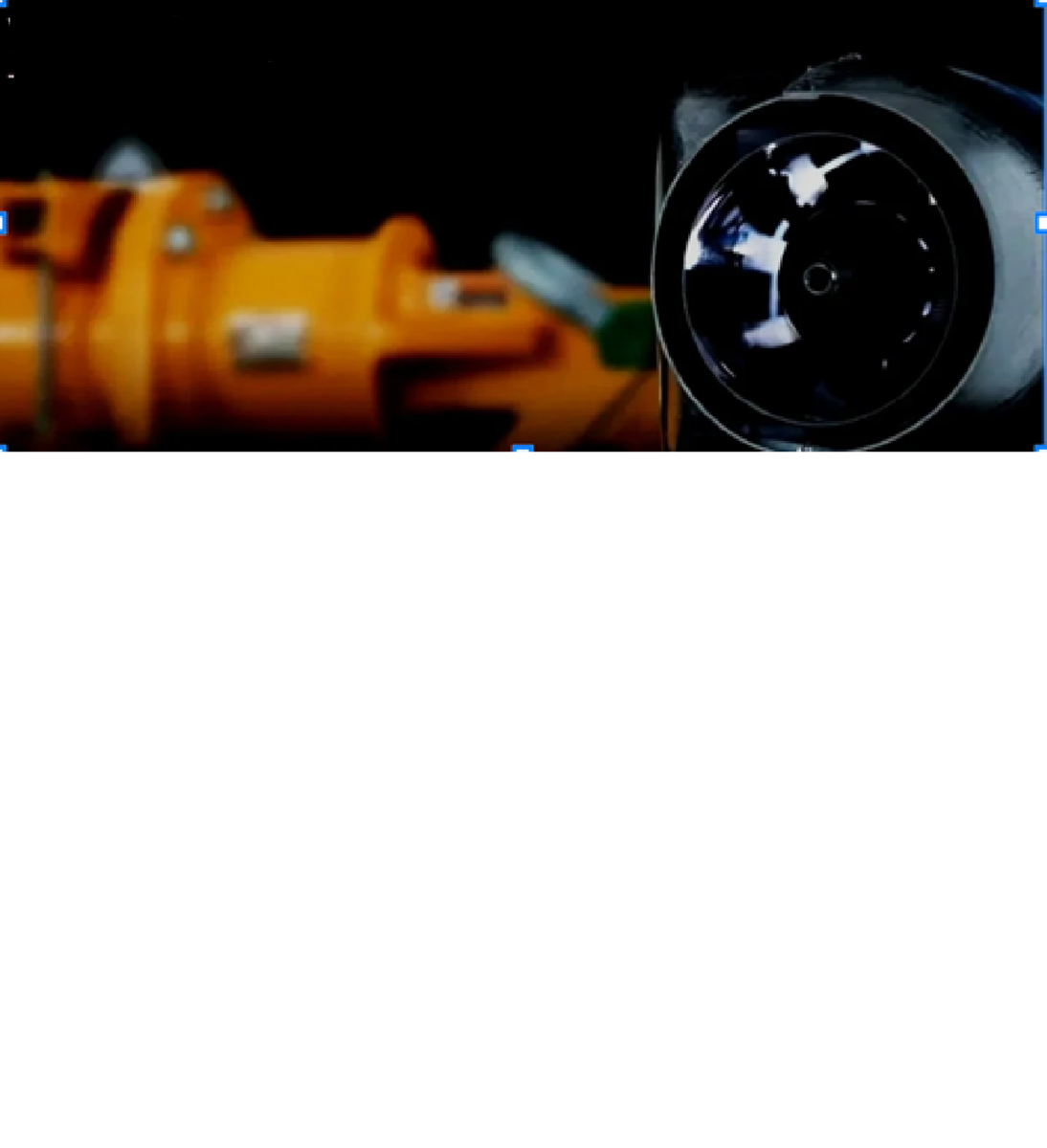 Close-up of a rocket engine nozzle with orange structural components and a black circular opening.