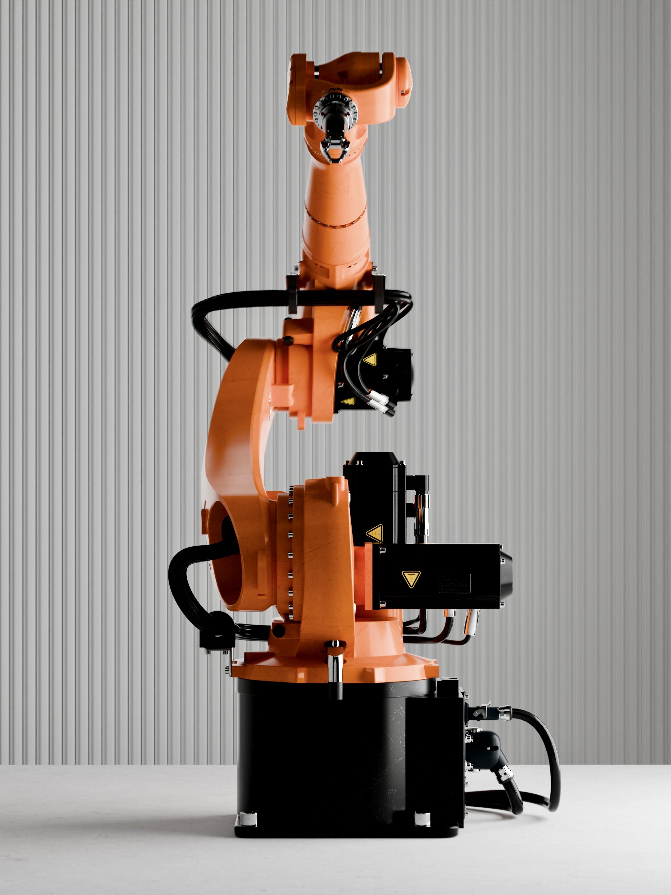 An orange industrial robotic arm with multiple joints and black cables, positioned against a white corrugated metal wall.