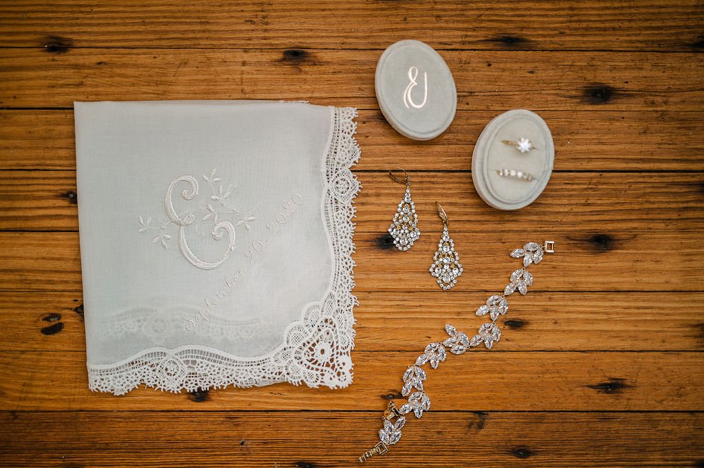 handkerchief and jewelry on wood floor