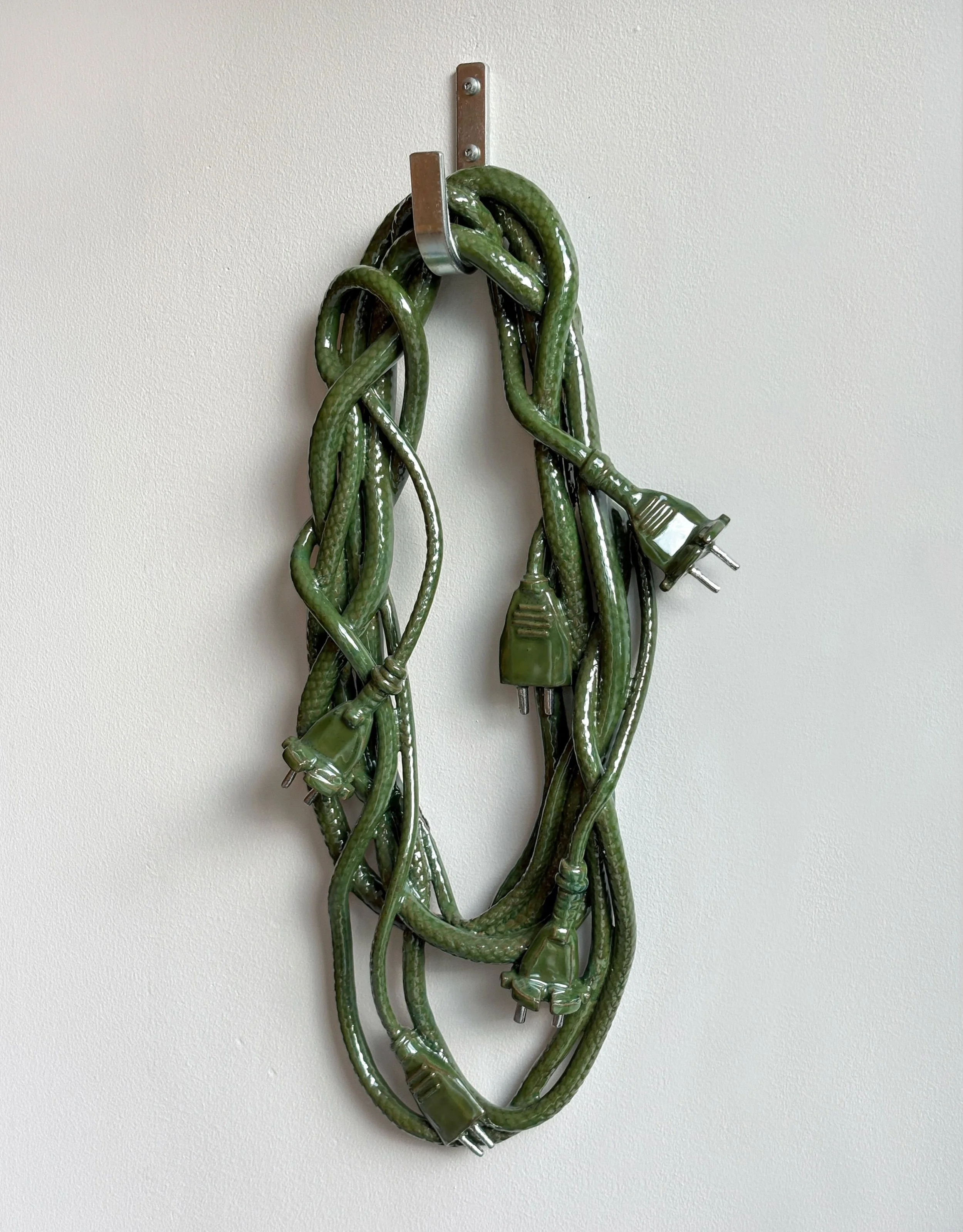 OHM, 2026 ⚡️

What happens when a practical object grows a skin of its own? 

A ceramic cable tangle exploring function, decoration and the strangely familiar. Hand-built in stoneware, with sculpted plugs and a hand-stamped, scaly surface.

Acquired 