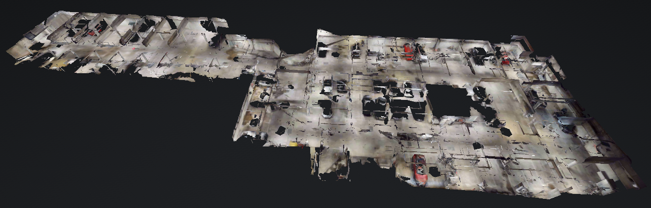 3D model of an indoor parking garage with multiple parked cars.