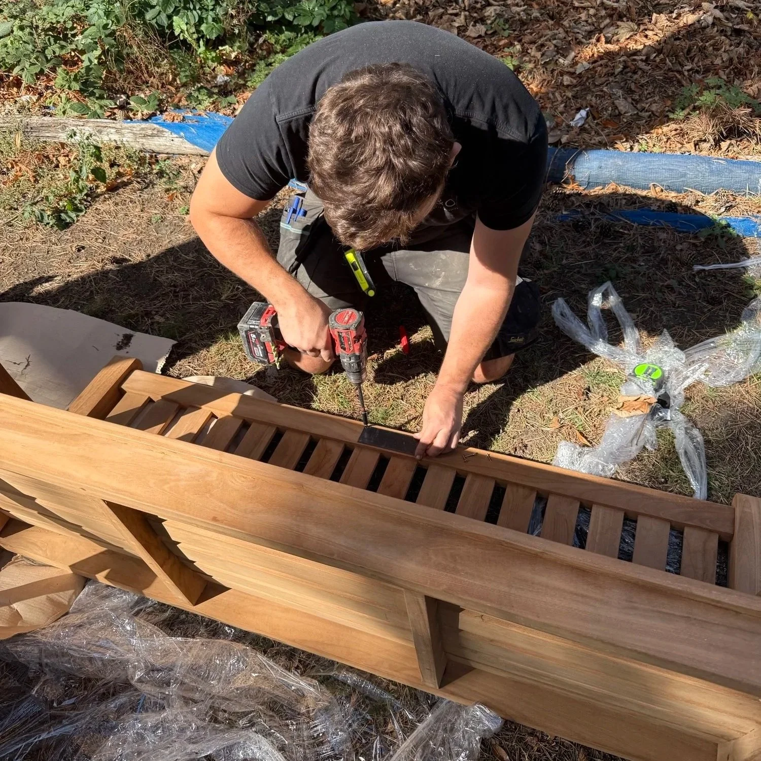 R&O Property Services team working on replacing a memorial bench in a London park