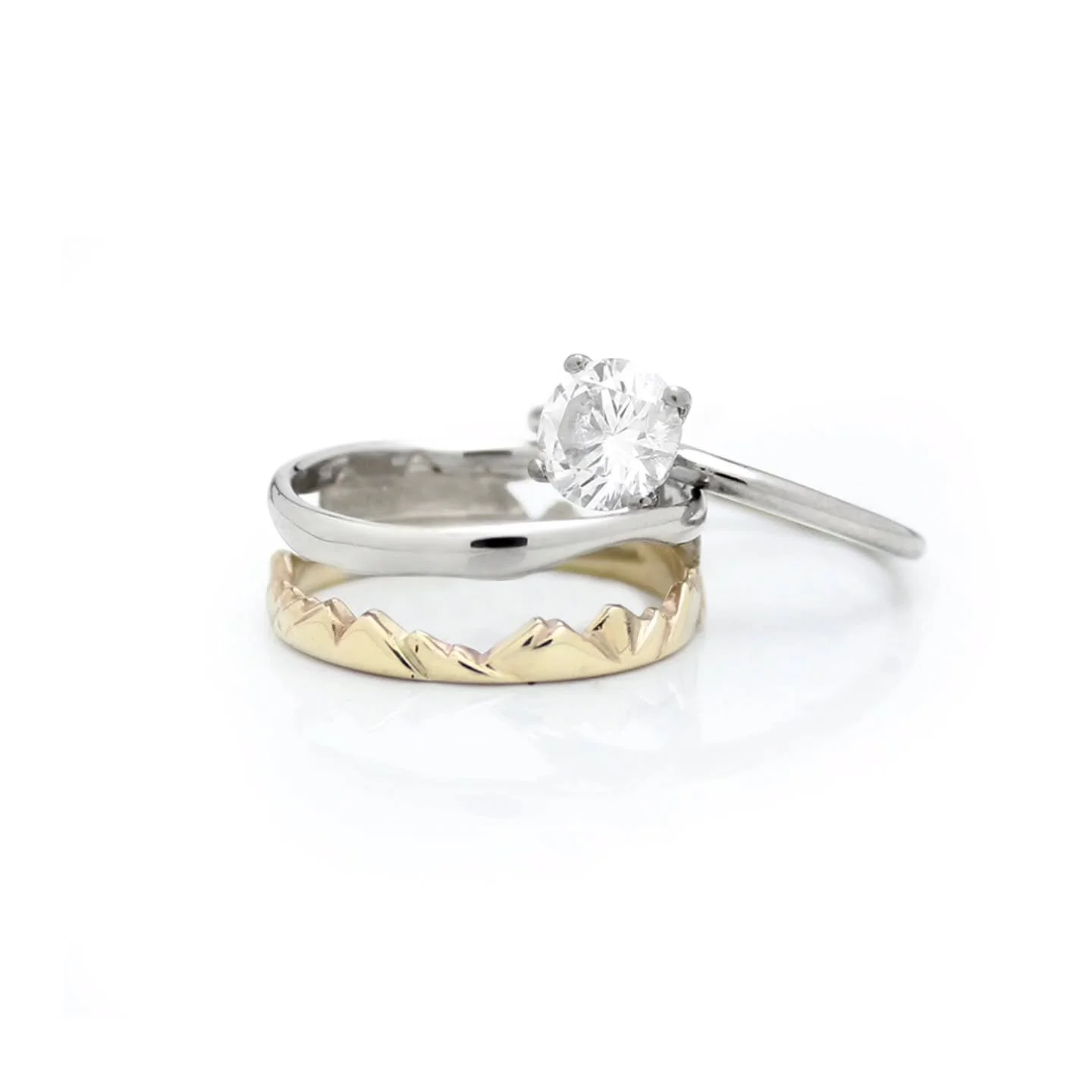 Aidan loves making rings that are nestled together, and bit outside of the box, and that reflect our clients themselves! Look at this beautiful mountain, moon and sky inspired ring set, and send it to a friend who may tue the knot soon. 

Anyone who 