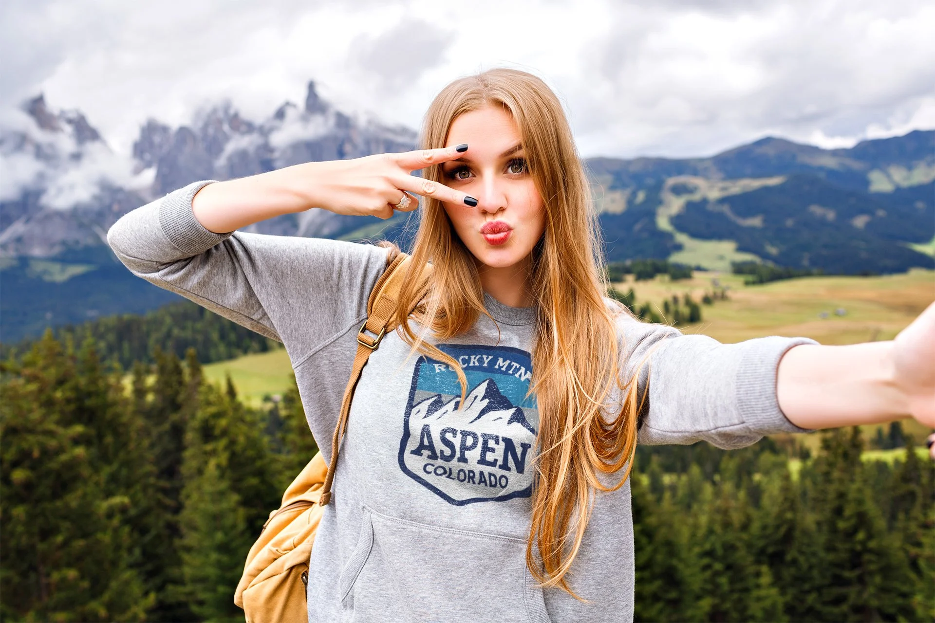pretty-blonde-traveler-woman-having-fun-mountains_displacement copy.jpg