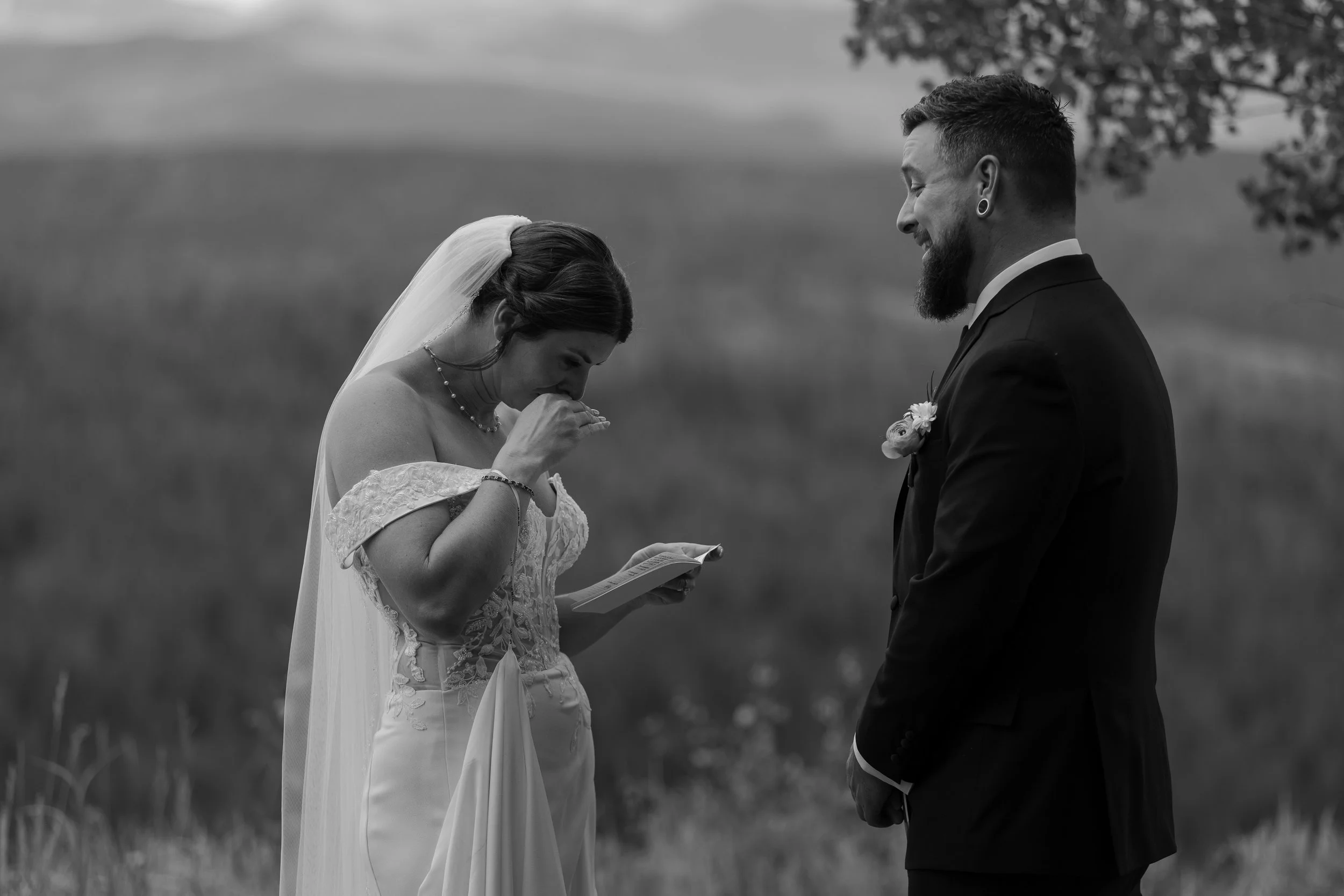 Couple sharing private vows before their wedding ceremony at Granby Ranch. Photography by Trail Magic Elopements and Micro Weddings.