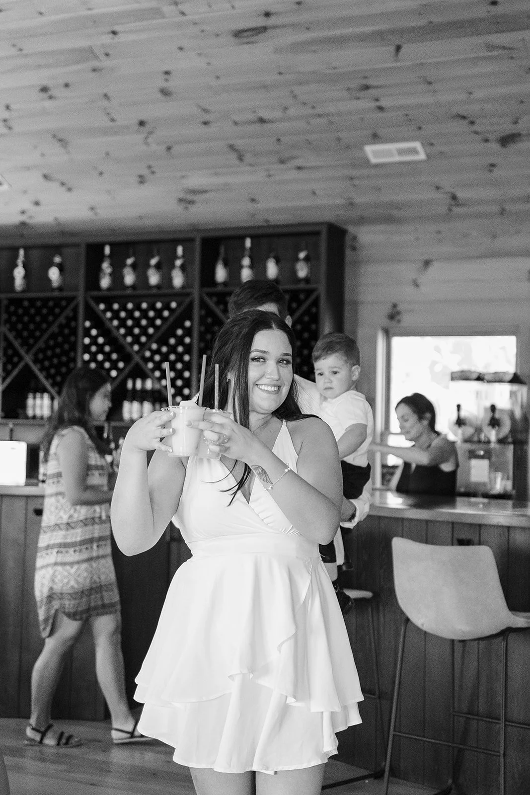 Bride getting wine slushies at her non-traditional micro wedding celebration. Photography by Trail Magic Elopements and Micro Weddings.