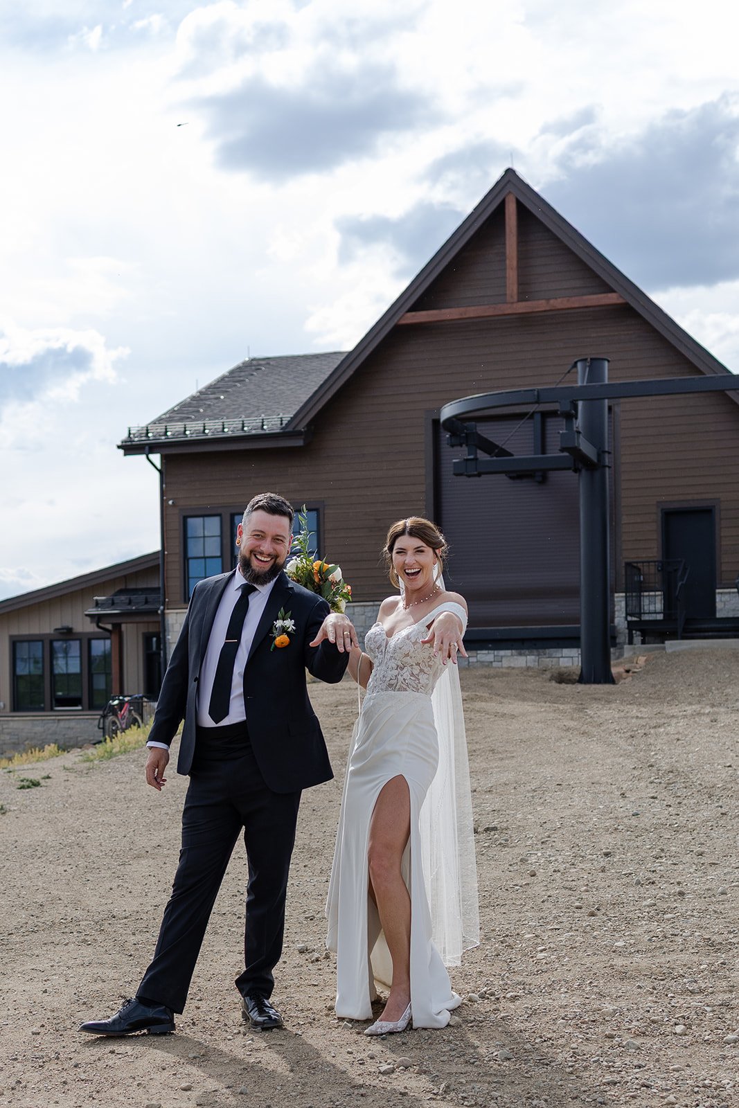 Couple showing off their rings after their wedding ceremony at Granby Ranch. Photography by Trail Magic Elopements and Micro Weddings.