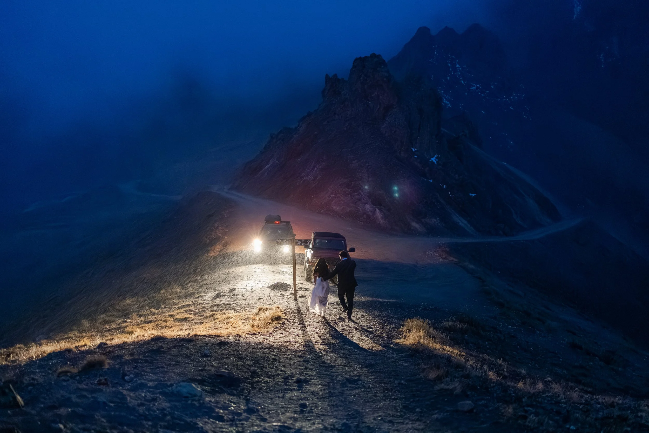 Couple hiking back to their jeep rental as the sun sets in the San Juan Mountains on their elopement day. Photography by Trail Magic Elopements and Micro Weddings.