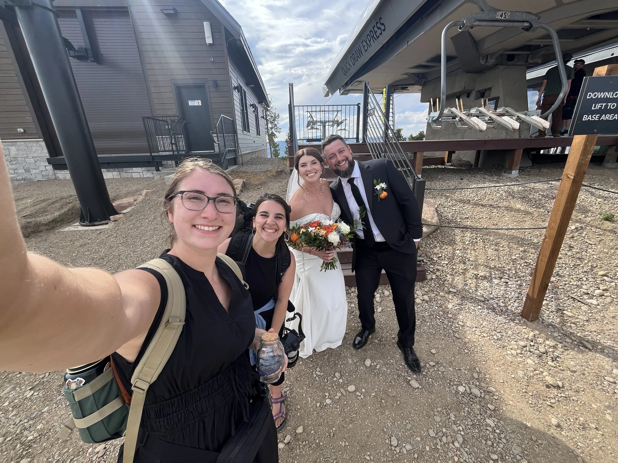 Couple posing for a selfie with their day of coordinator and wedding photographer at Granby Ranch. Photography by Trail Magic Elopements and Micro Weddings.