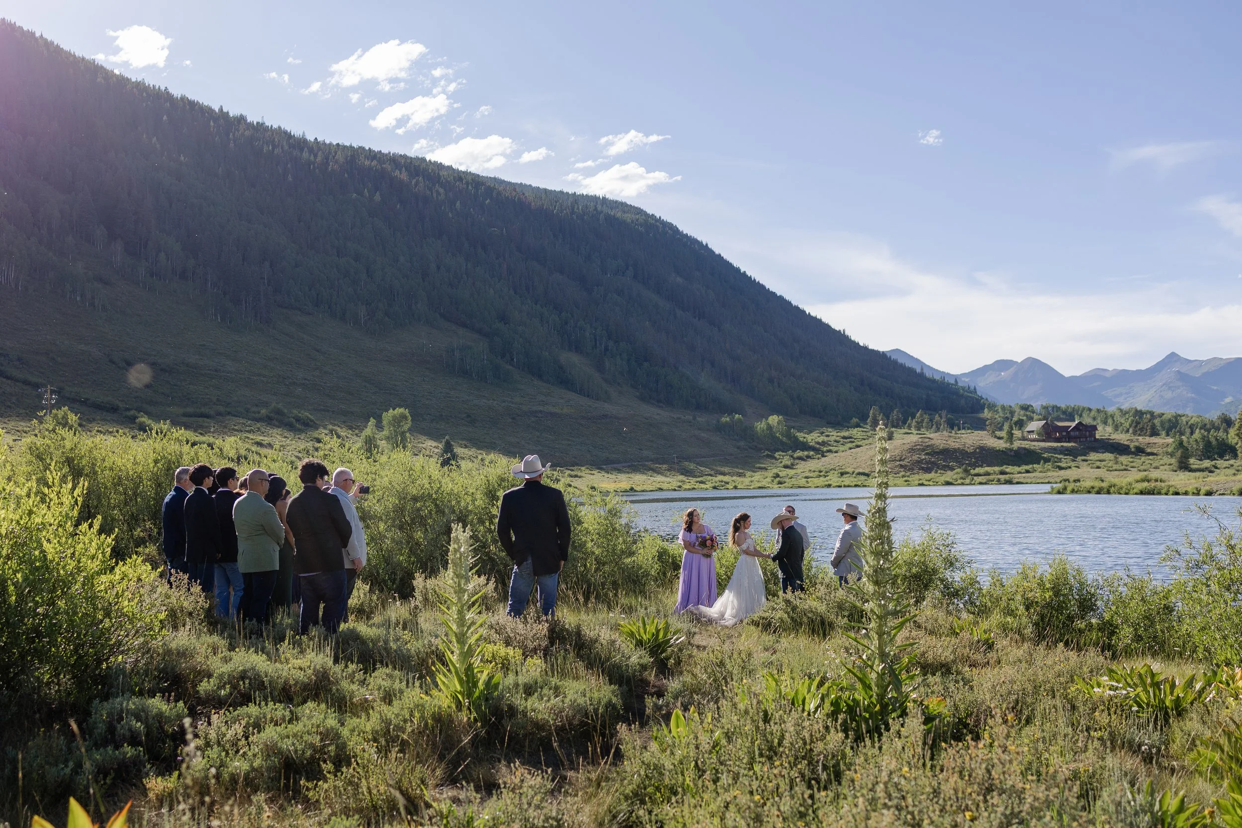 Couple getting married at Peanut Lake in Crested Butte in the Summer. Photography by Trail Magic Elopements and Micro Weddings.