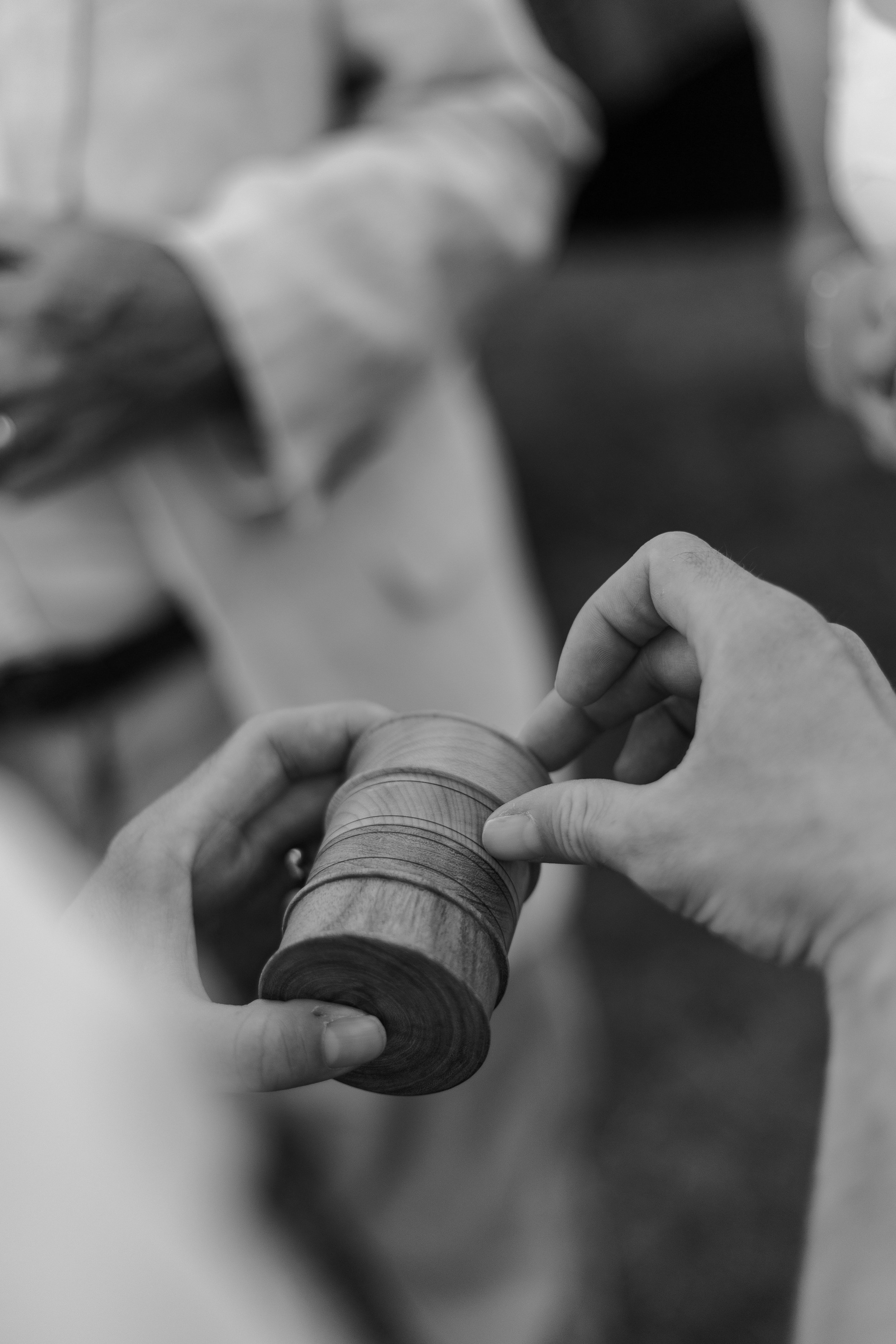 Couple sharing hand-made wooden ring box to guests at their non-traditional micro wedding celebration. Photography by Trail Magic Elopements and Micro Weddings.