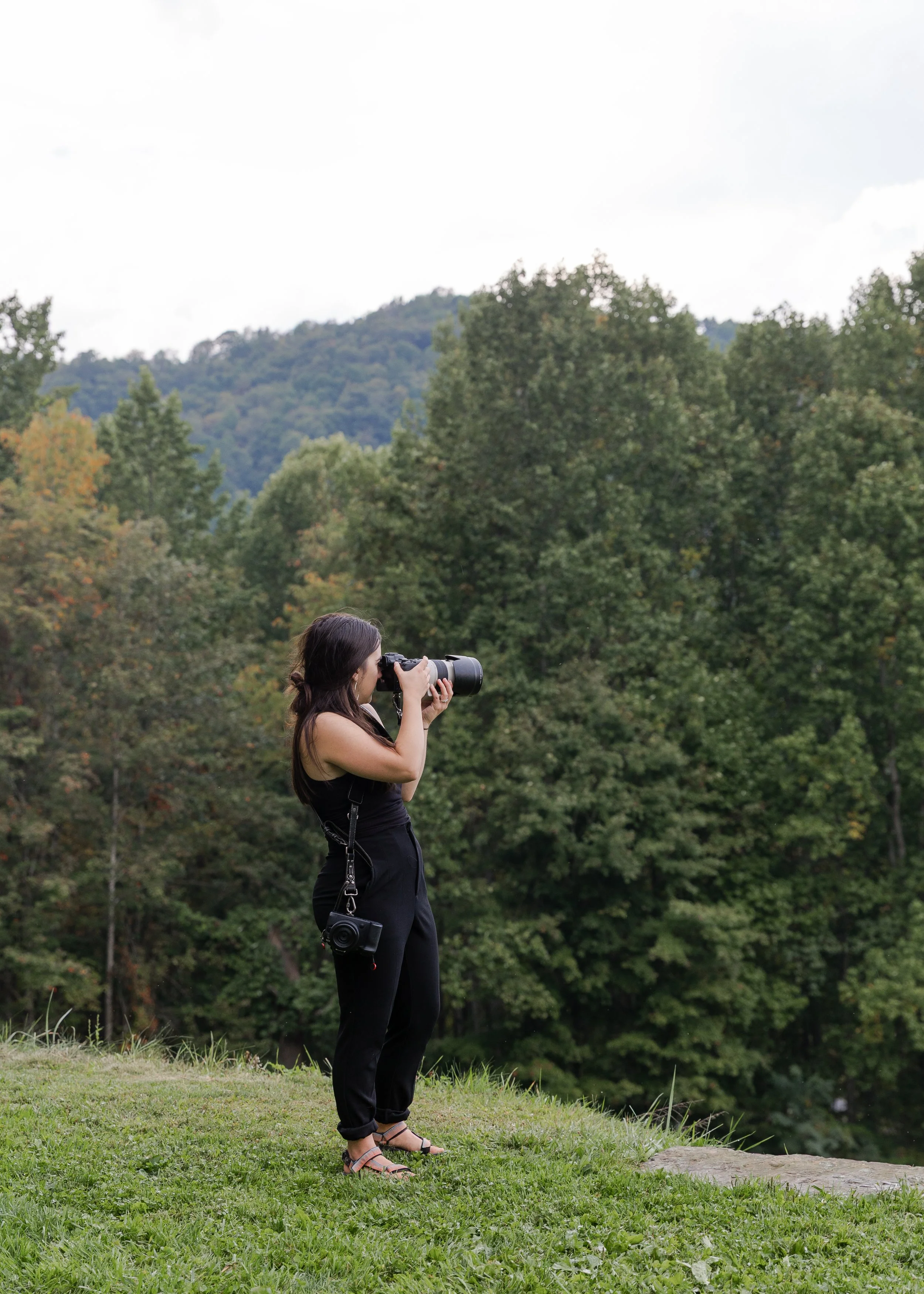 Elopement photographer photographing a couple during their elopement. Photography by Trail Magic Elopements and Micro weddings.