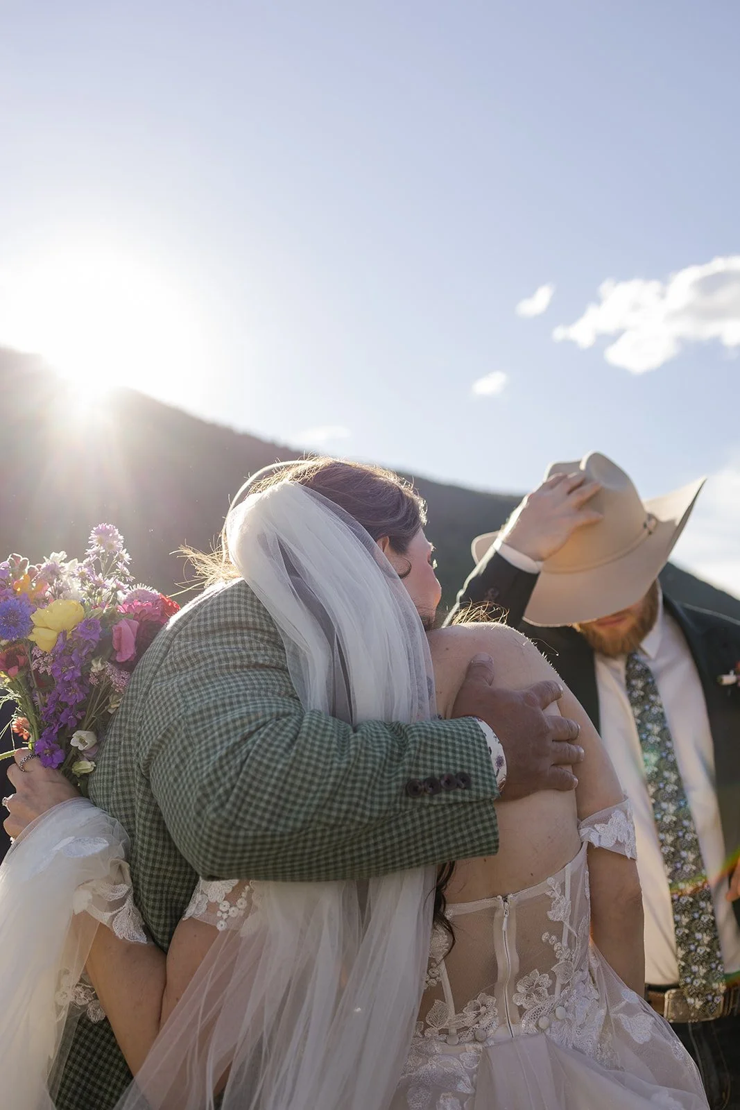 Bride embracing her guests after her micro wedding at Peanut Lake in Crested Butte, Colorado. Photography by Trail Magic Elopements and Micro Weddings.