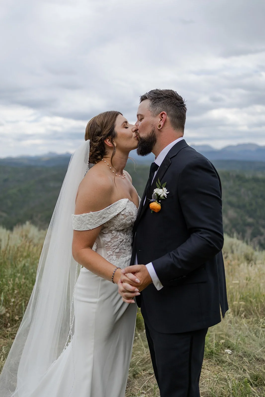 Couple posing before their wedding ceremony at Granby Ranch. Photography by Trail Magic Elopements and Micro Weddings.