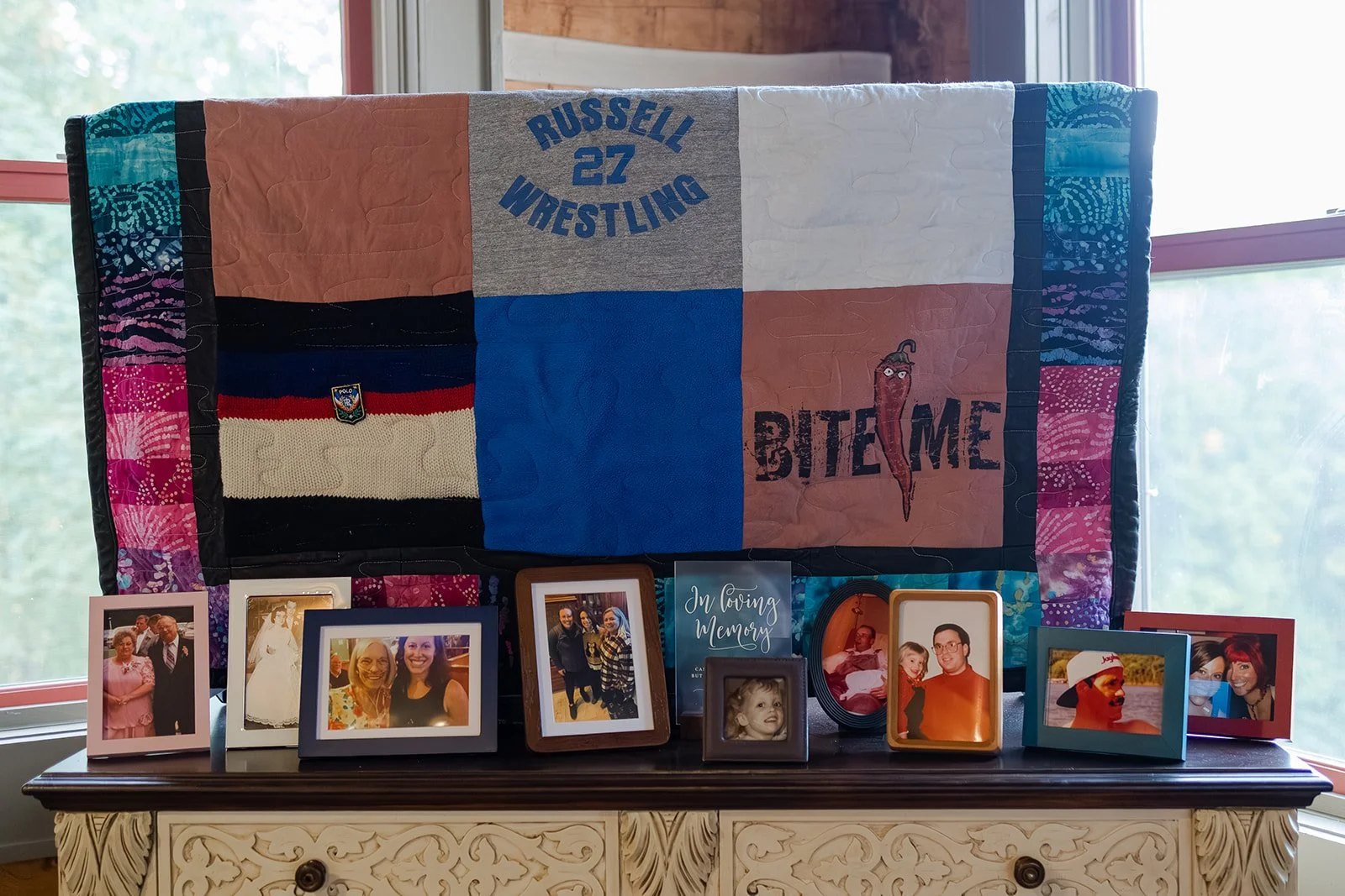 Sentimental family member station of photos at a couple's non-traditional micro wedding celebration. Photography by Trail Magic Elopements and Micro Weddings.