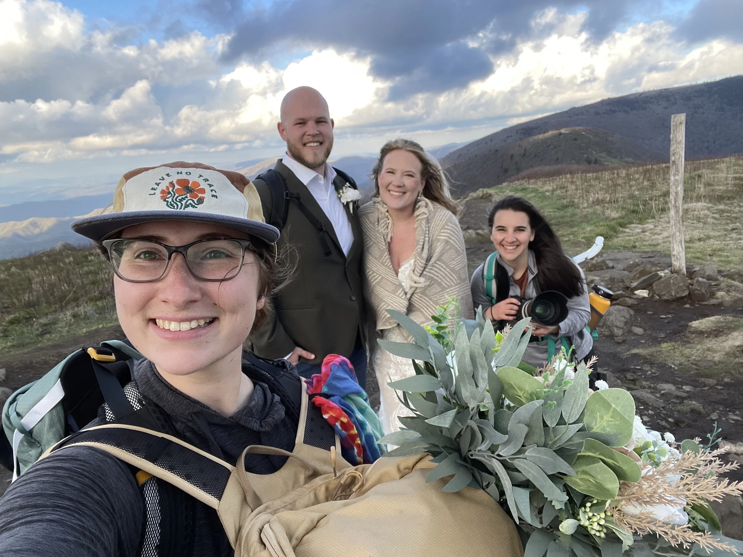 North Carolina Elopement Planner and Elopement Photographer taking a selfie with their couple after their elopement on Roan Mountain. Photography and planning by Trail Magic Elopements and Micro Weddings.