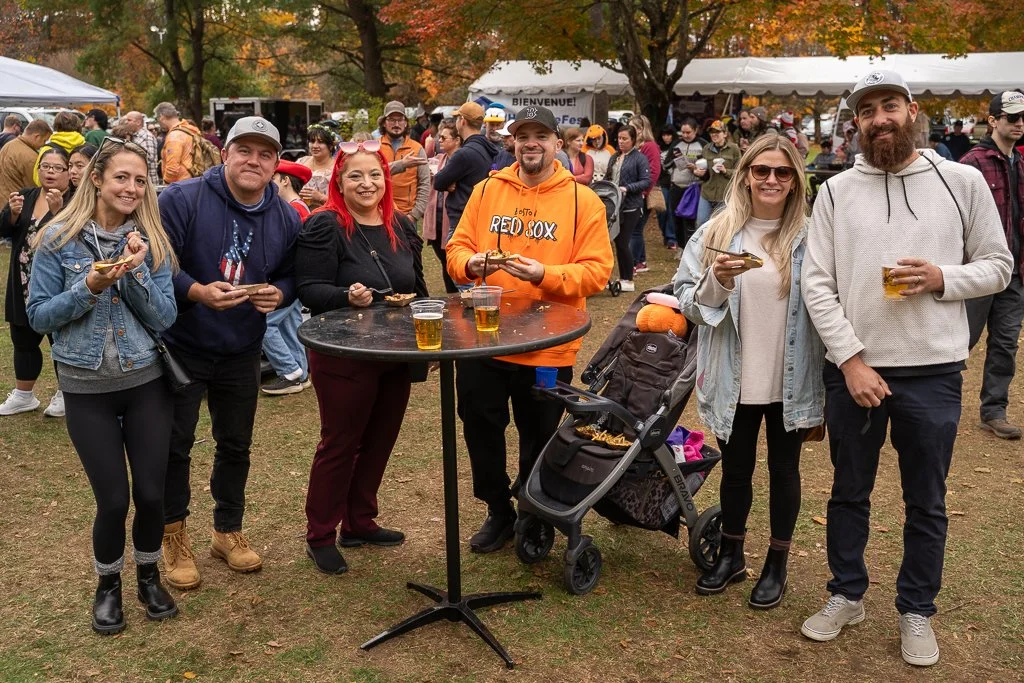 A family enjoys poutine at NH PoutineFest