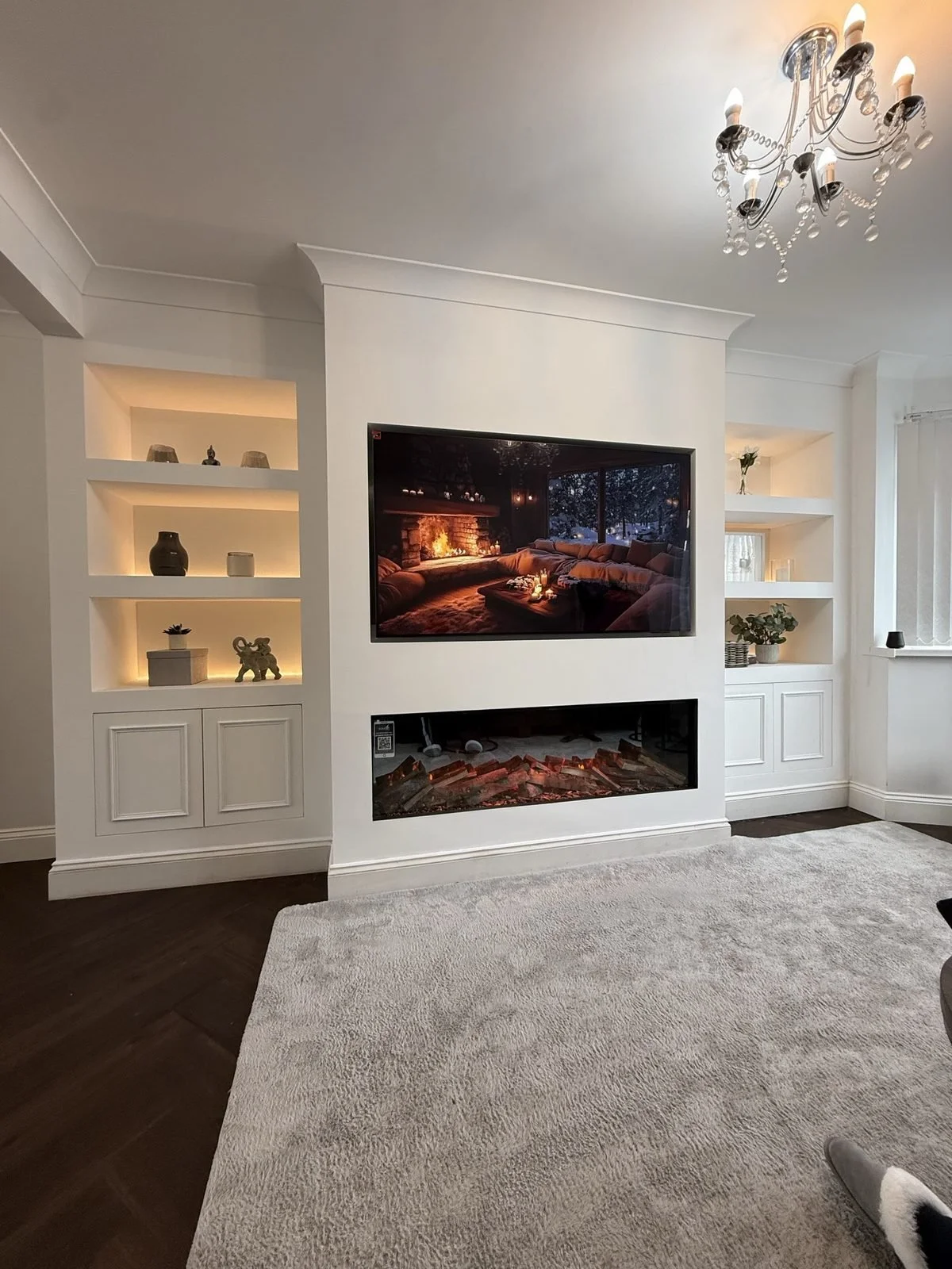 Finished media wall with recessed TV, shelving and electric fire