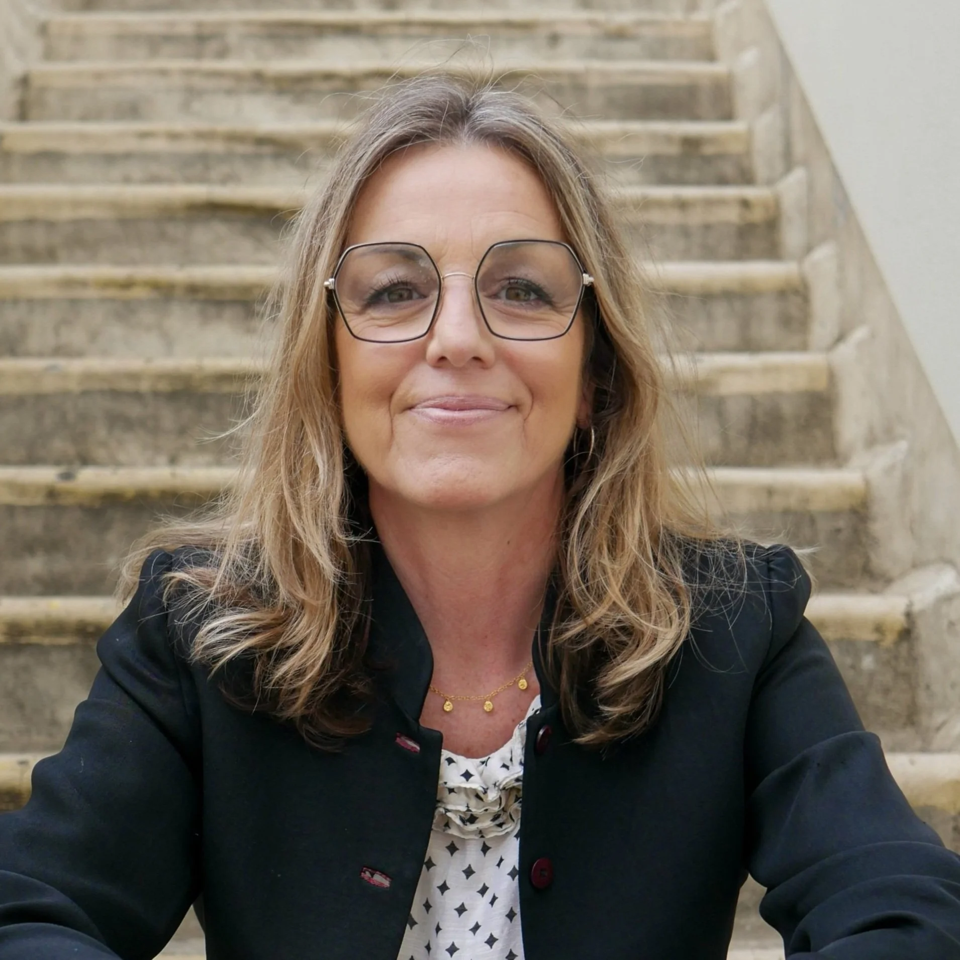 Debbie Johnson Trainee Couples Therapist sitting on step