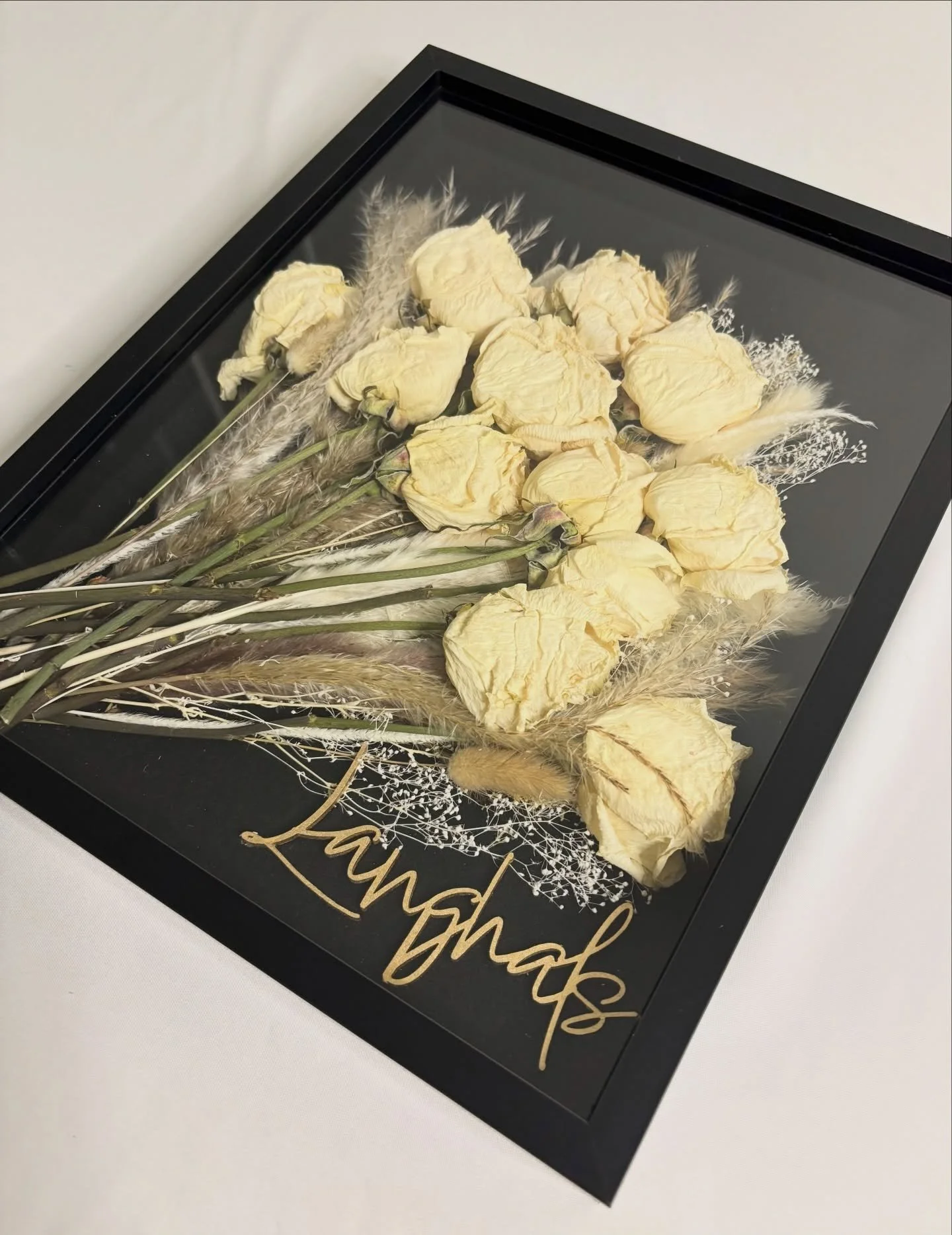 This custom shadow box was a joy to create. 🤍 The client had the sweetest idea to include her wedding cake topper with her preserved florals.