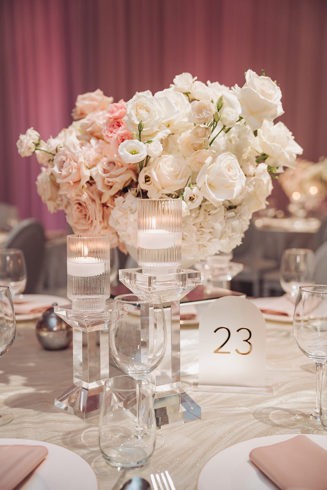 Blush and white rose wedding centrepiece with crystal floating candles at Château Le Parc, by Ethereal Creators.