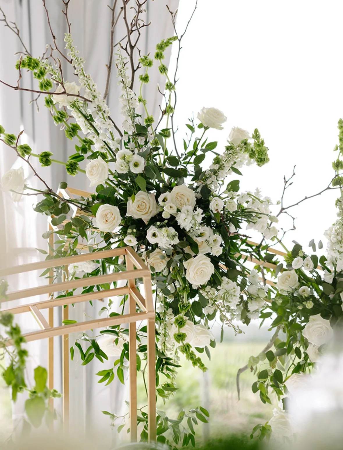 White Floral Ceremony Arch at Willow Springs Winery Wedding