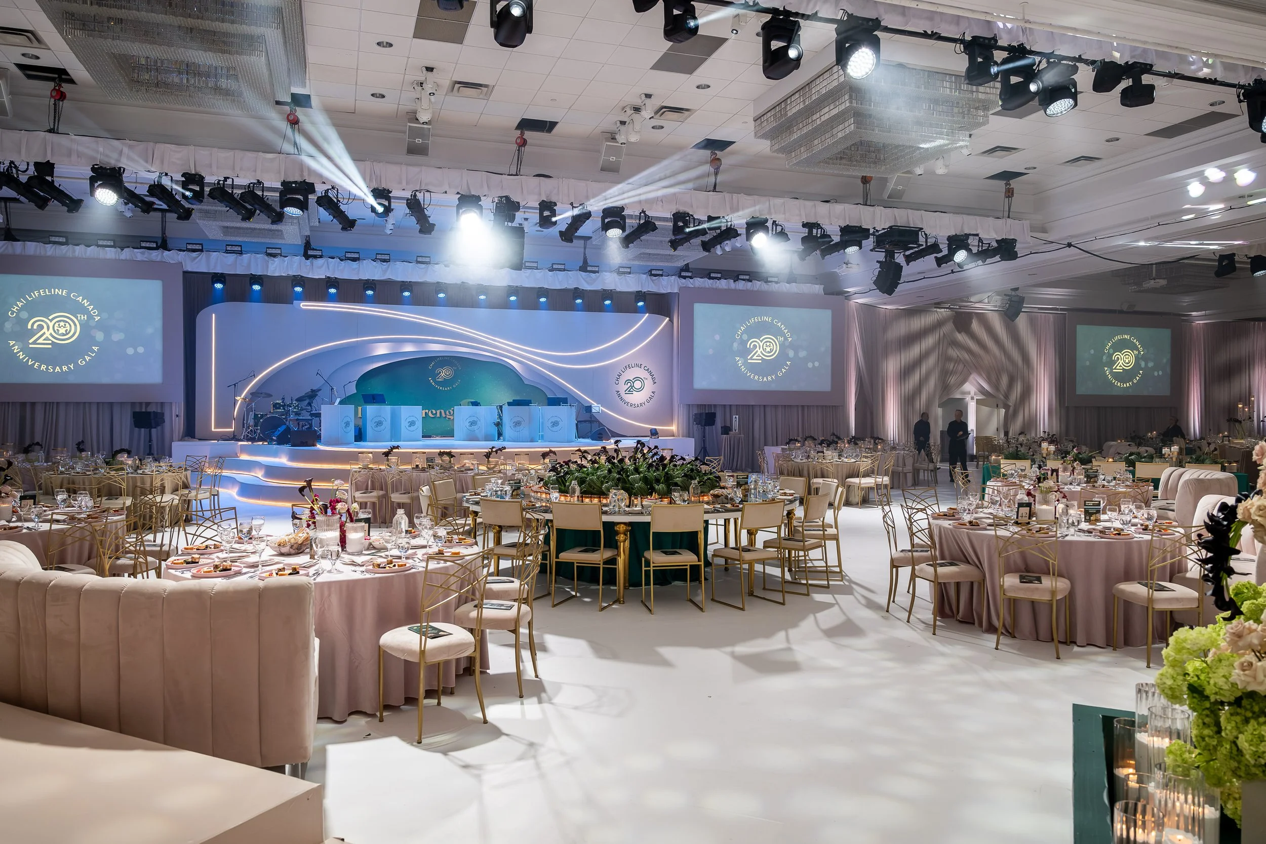 The custom branded stage and transformed ballroom at the Chai Lifeline Canada 20th Anniversary Gala. Designed by Ethereal Creators