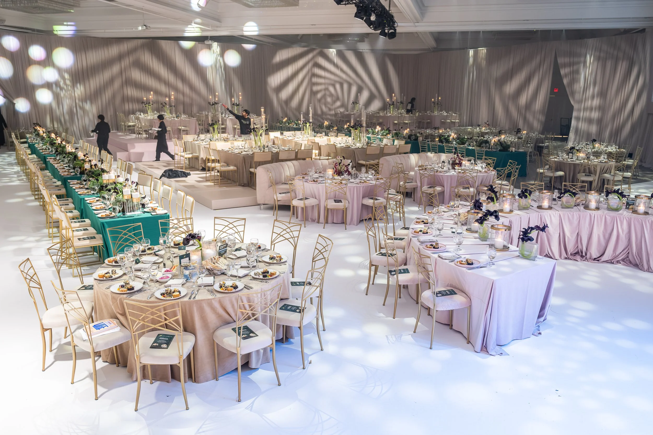 The fully transformed ballroom — draping, custom flooring and projected gobo lighting across 800 guests. Designed by Ethereal Creators.