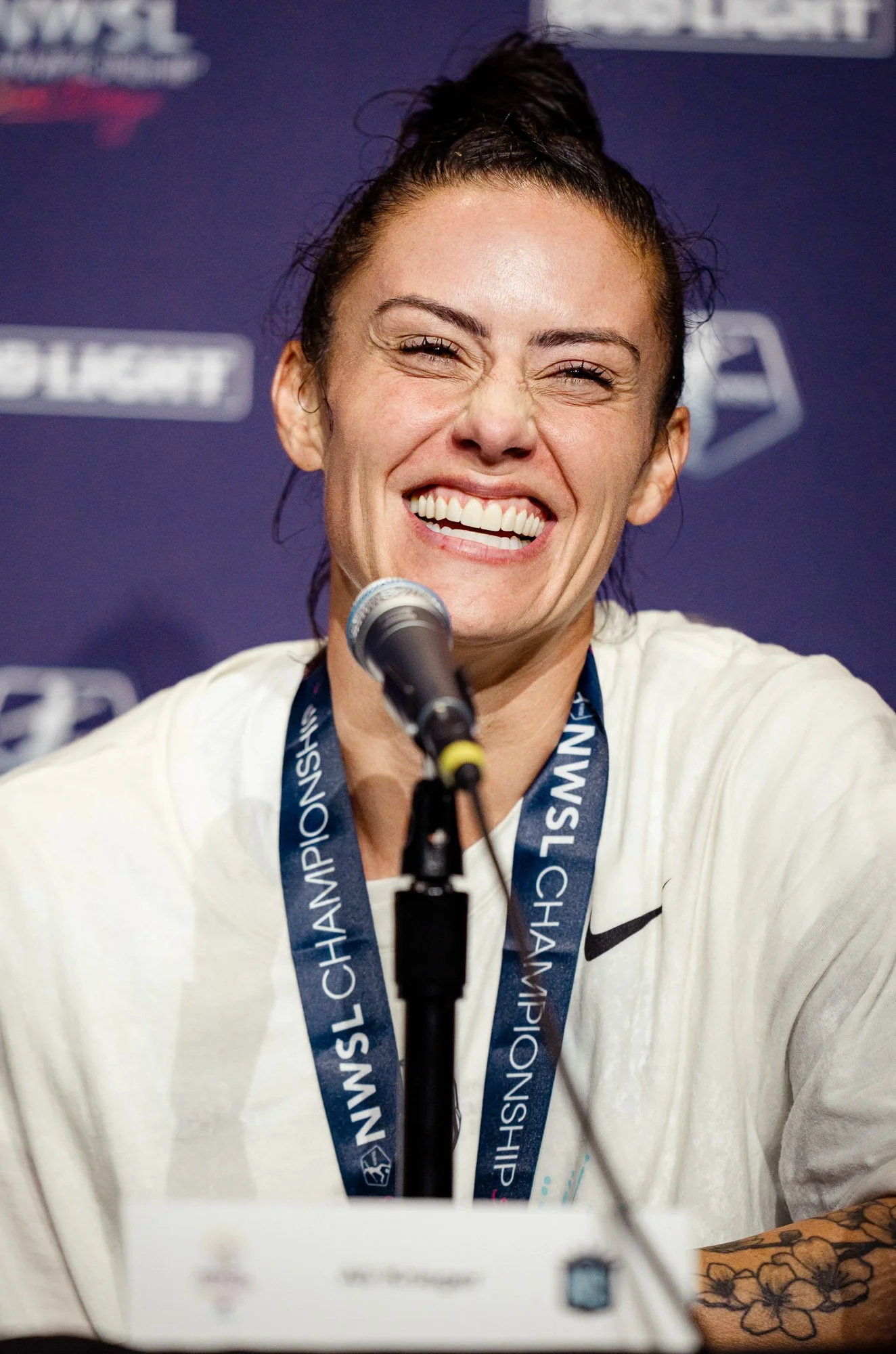 Ali Krieger smiles while answering questions during the post-match press conference following the 2023 NWSL Championship at Snapdragon Stadium in San Diego, California. The match marked the final professional appearance of Krieger’s career and conclu